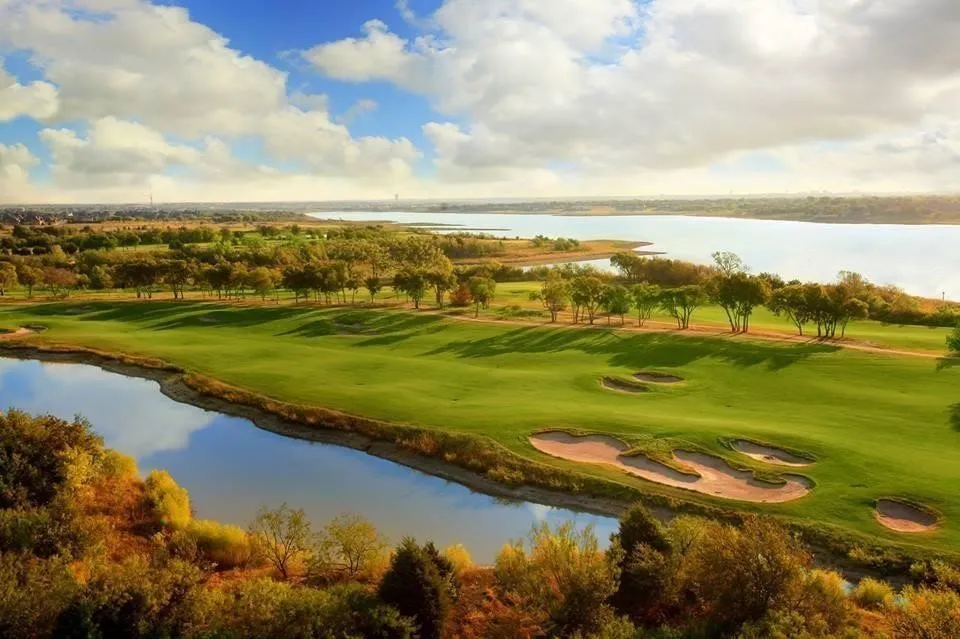 View of community with golf course view and a water view