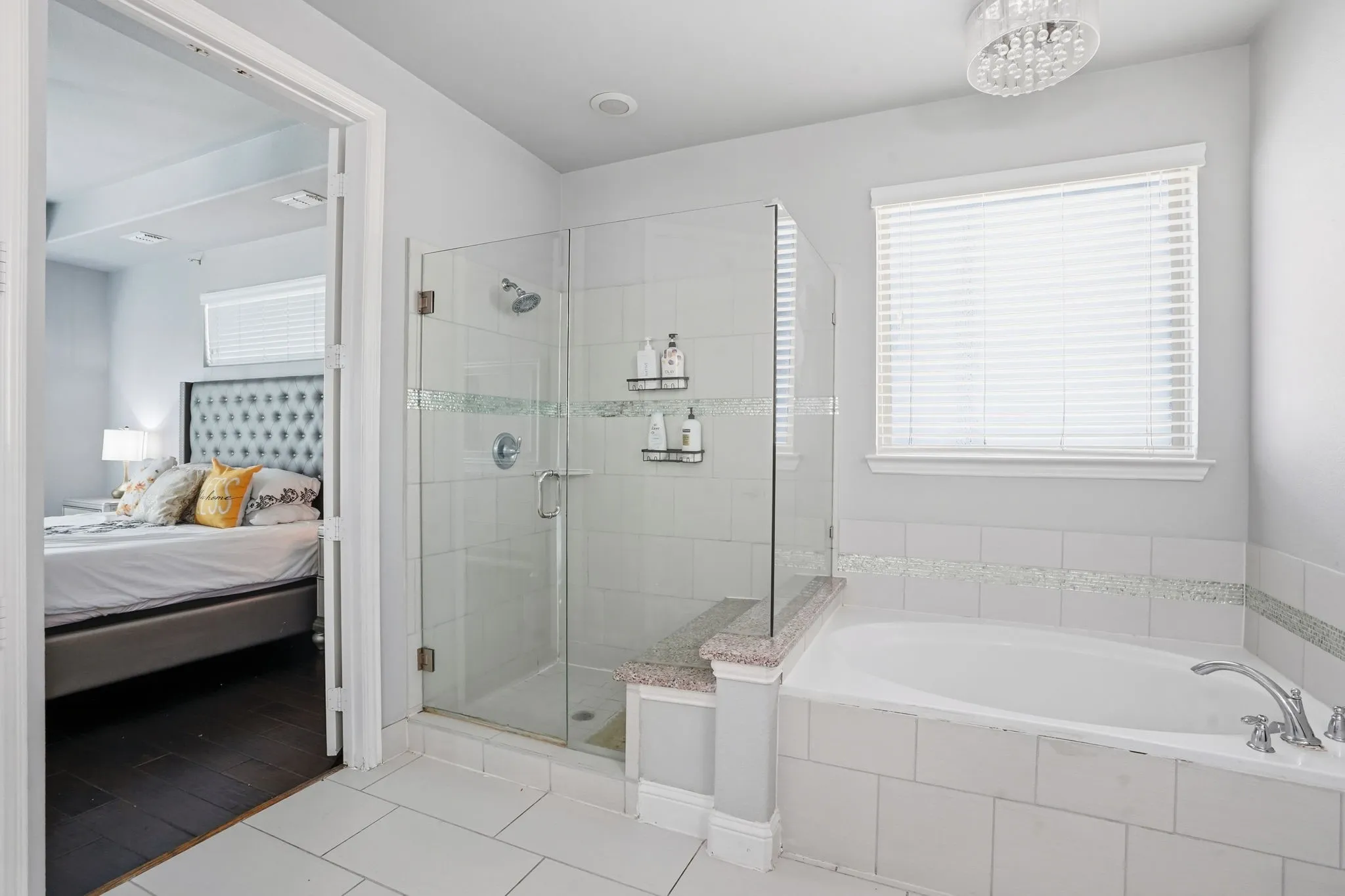Full bathroom with connected bathroom, a garden tub, a stall shower, and light tile patterned flooring