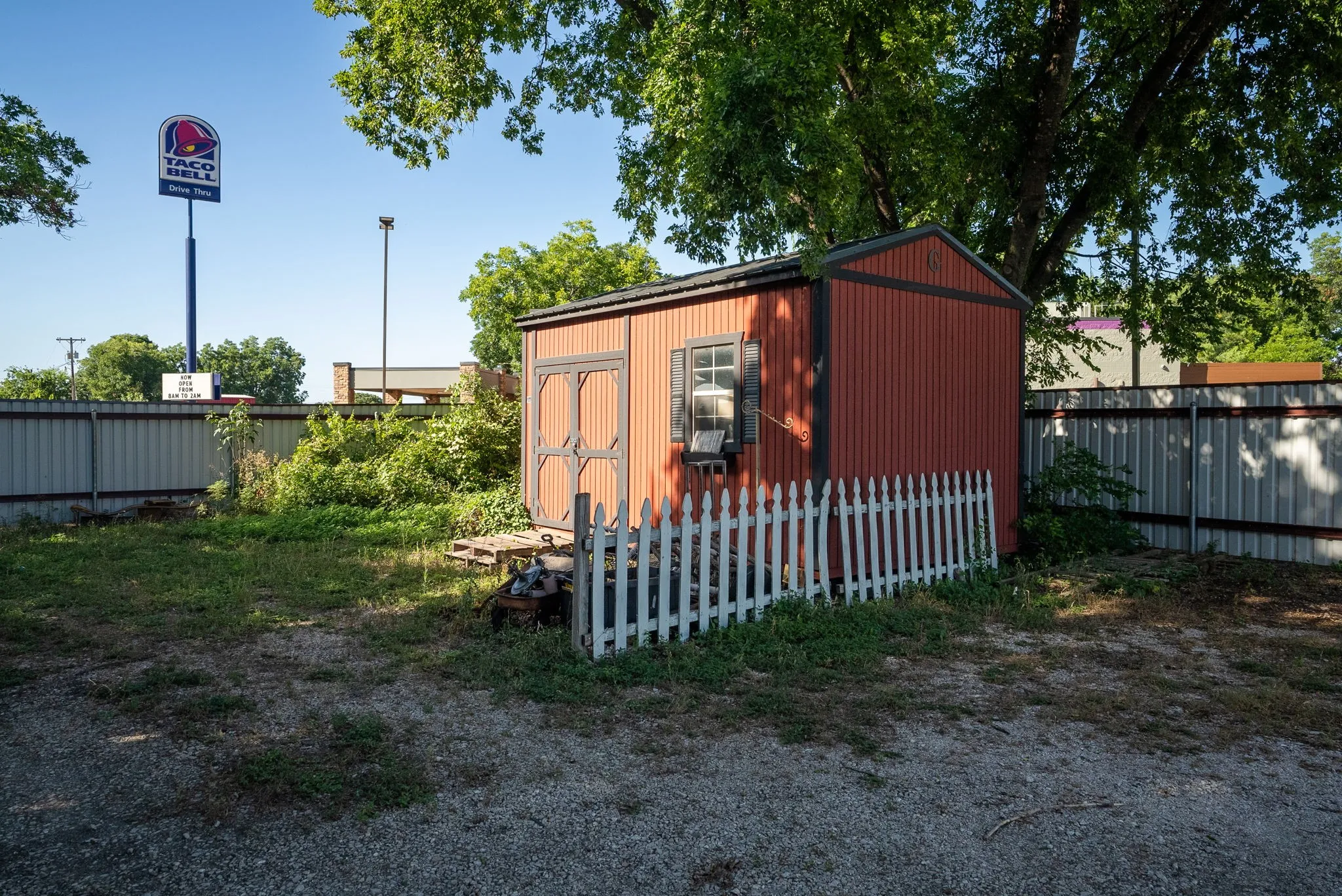 View of shed with a fenced backyard