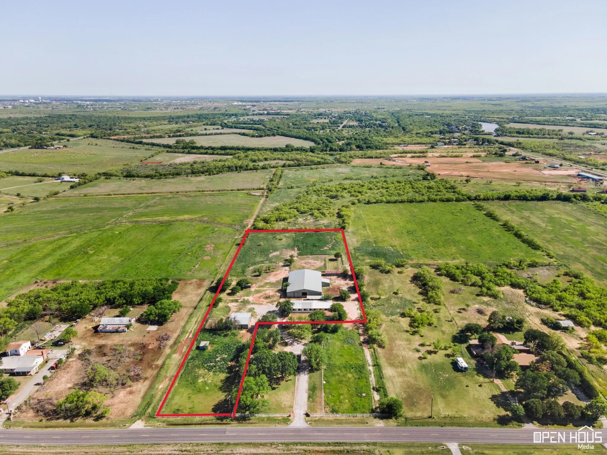 Overview of rural landscape featuring farmland and property boundaries highlighted