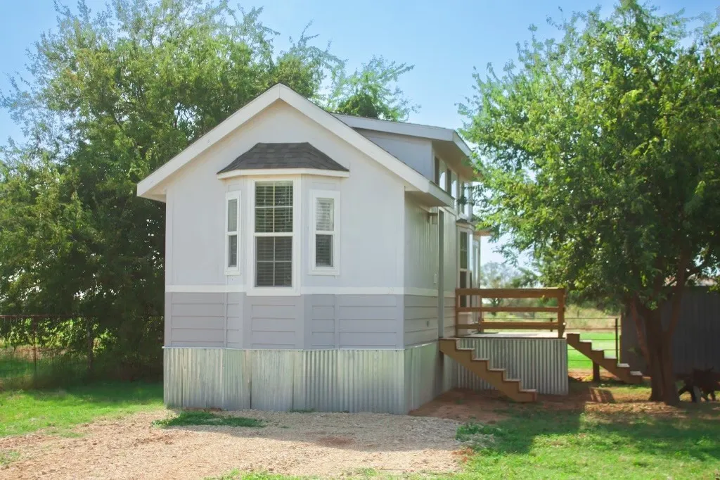 View of side of property featuring a deck
