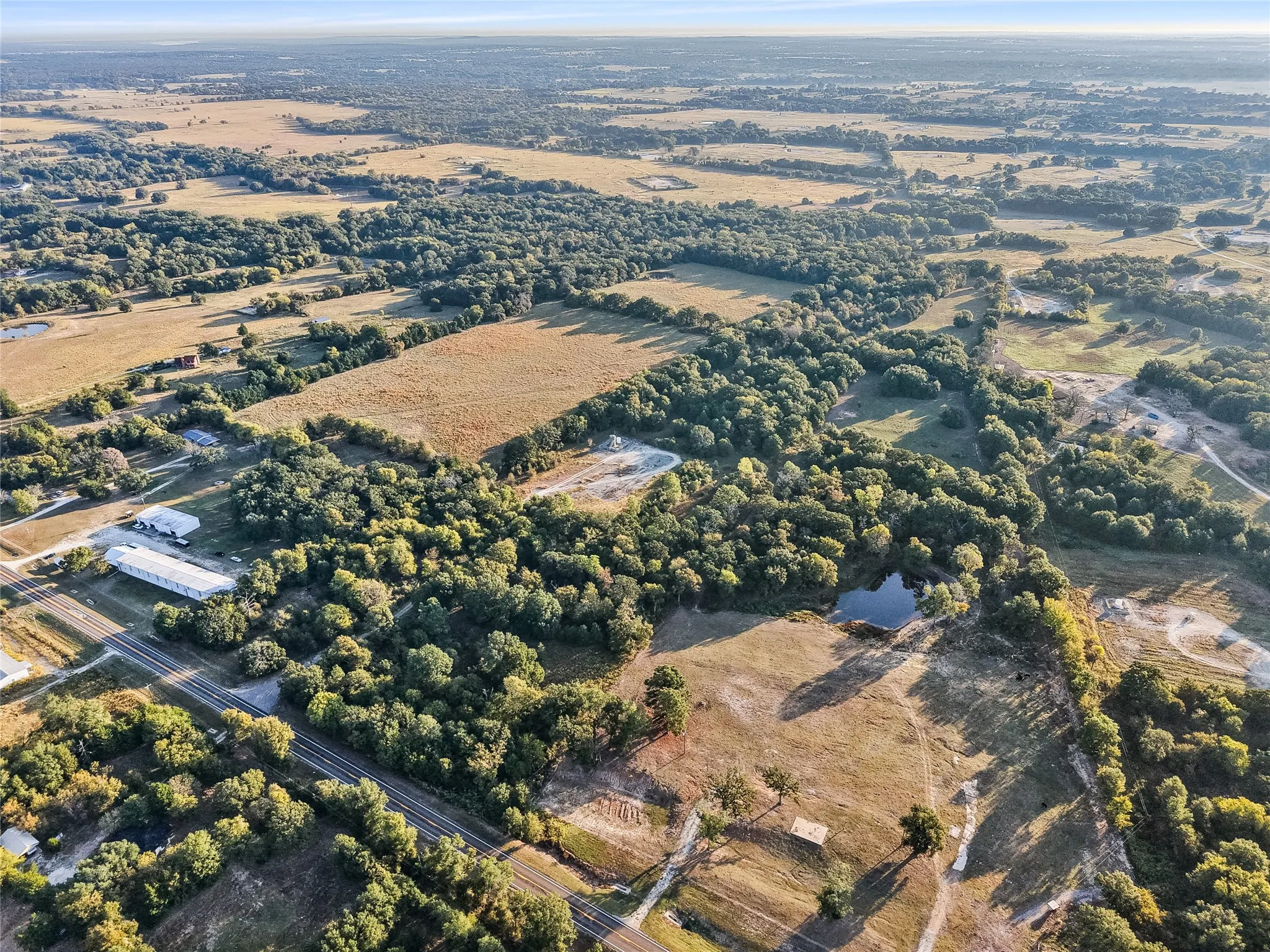 Aerial overview of property's location featuring rural landscape