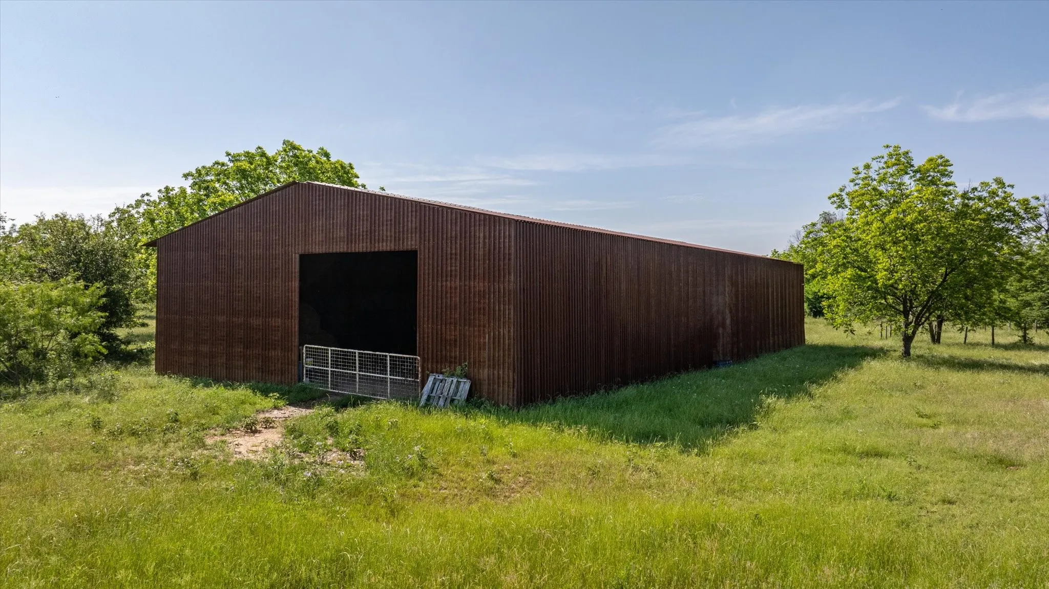 Barn measures approximately 100ft by 50ft
