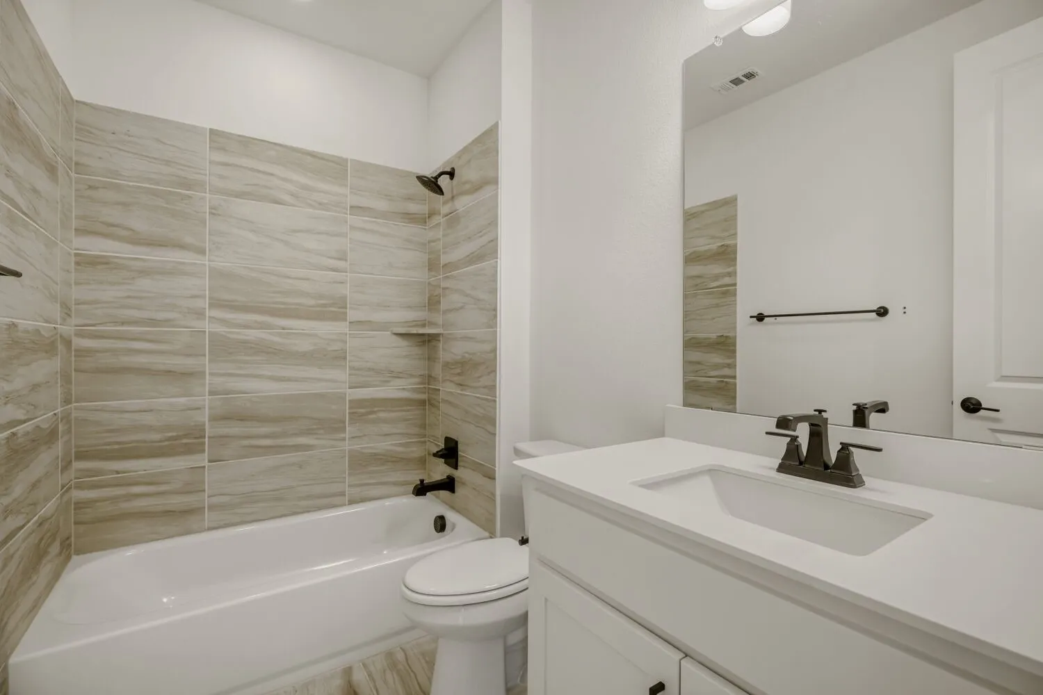 Bathroom with shower / bathtub combination and vanity