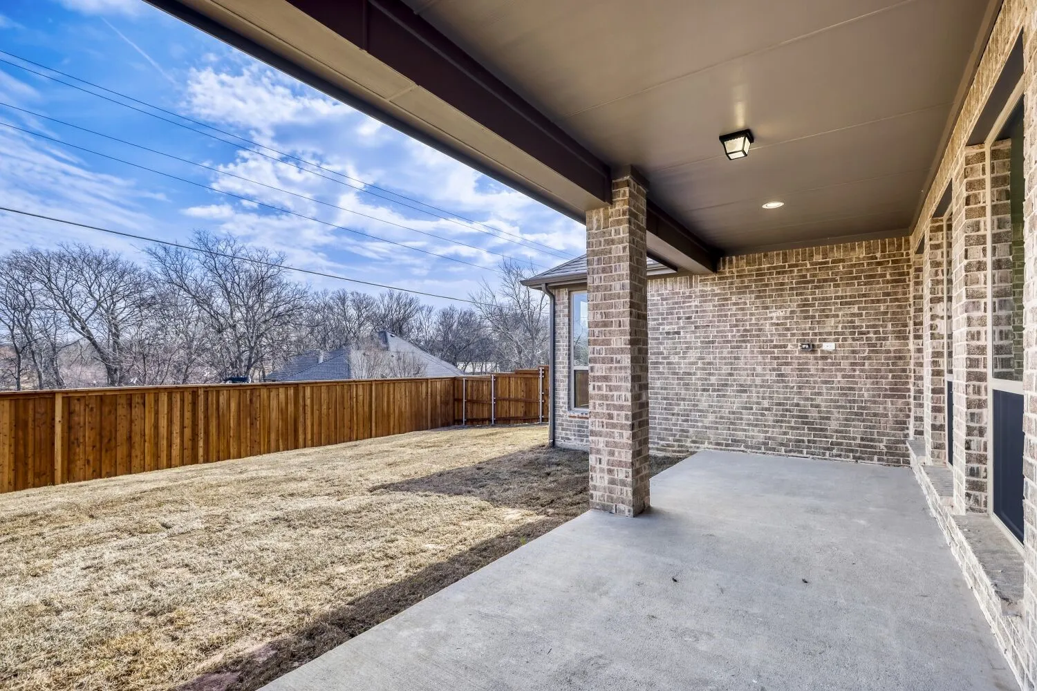 Fenced backyard featuring a patio area