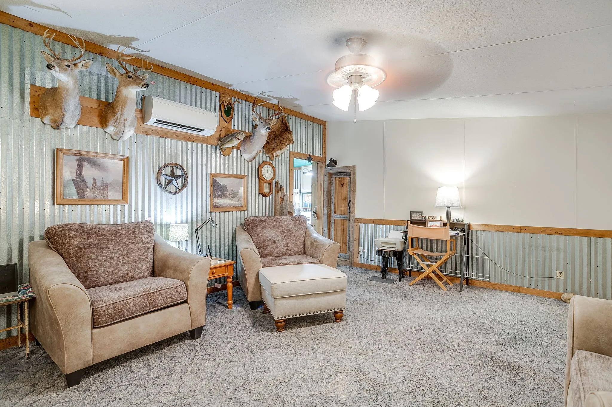 Sitting room featuring carpet, a wainscoted wall, a ceiling fan, and a wall mounted AC