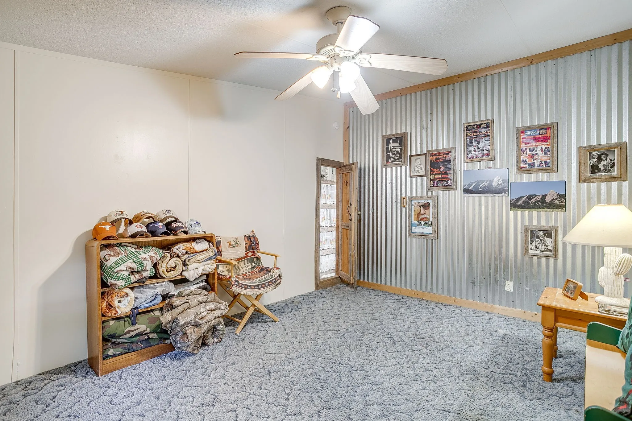 Playroom featuring carpet, a ceiling fan, and crown molding