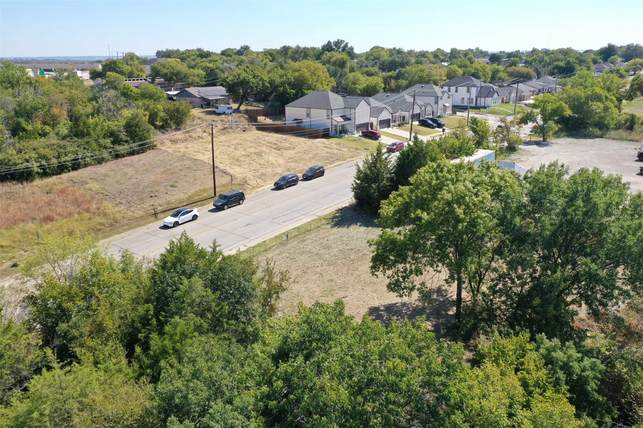 Aerial view of residential area with a tree filled landscape