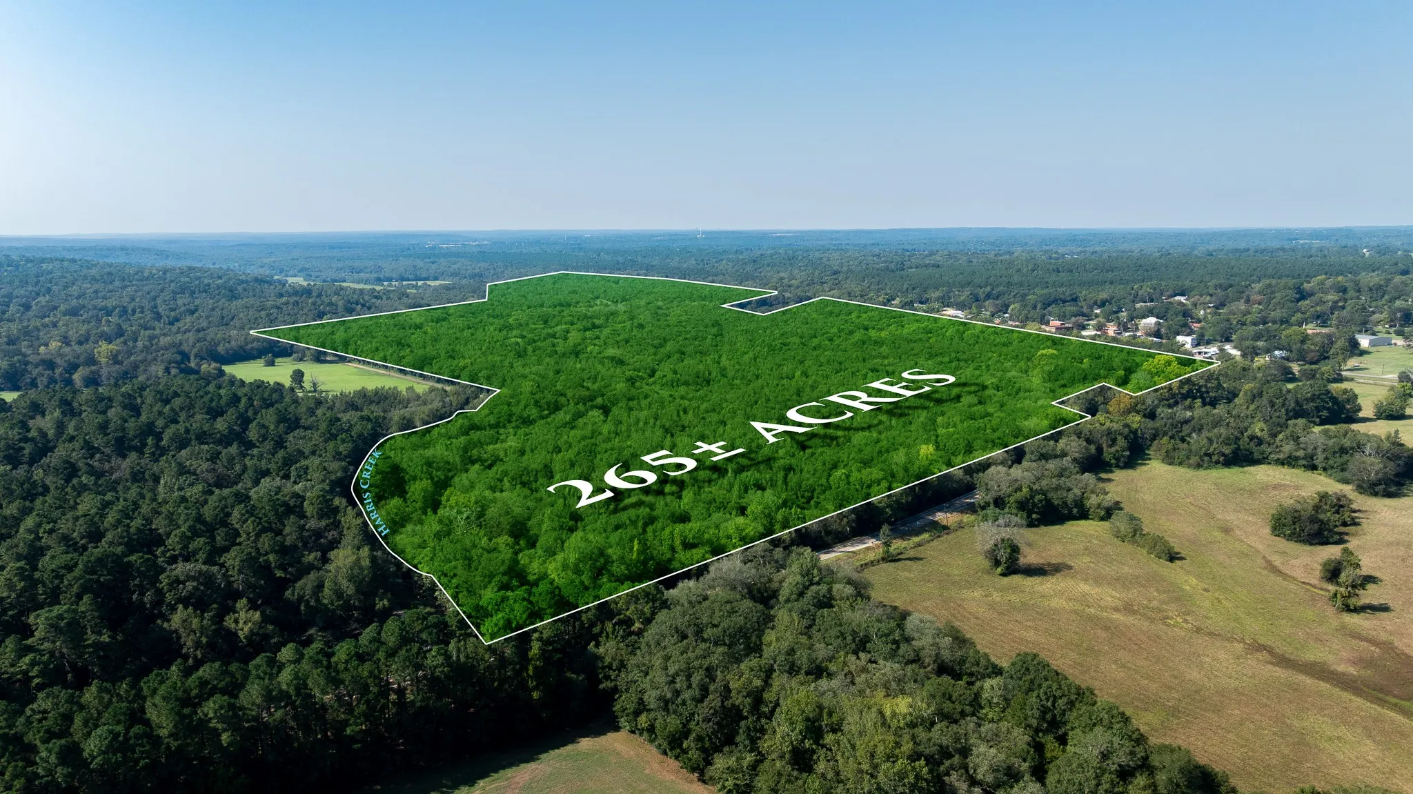 Aerial view of property and surrounding area with property boundaries highlighted