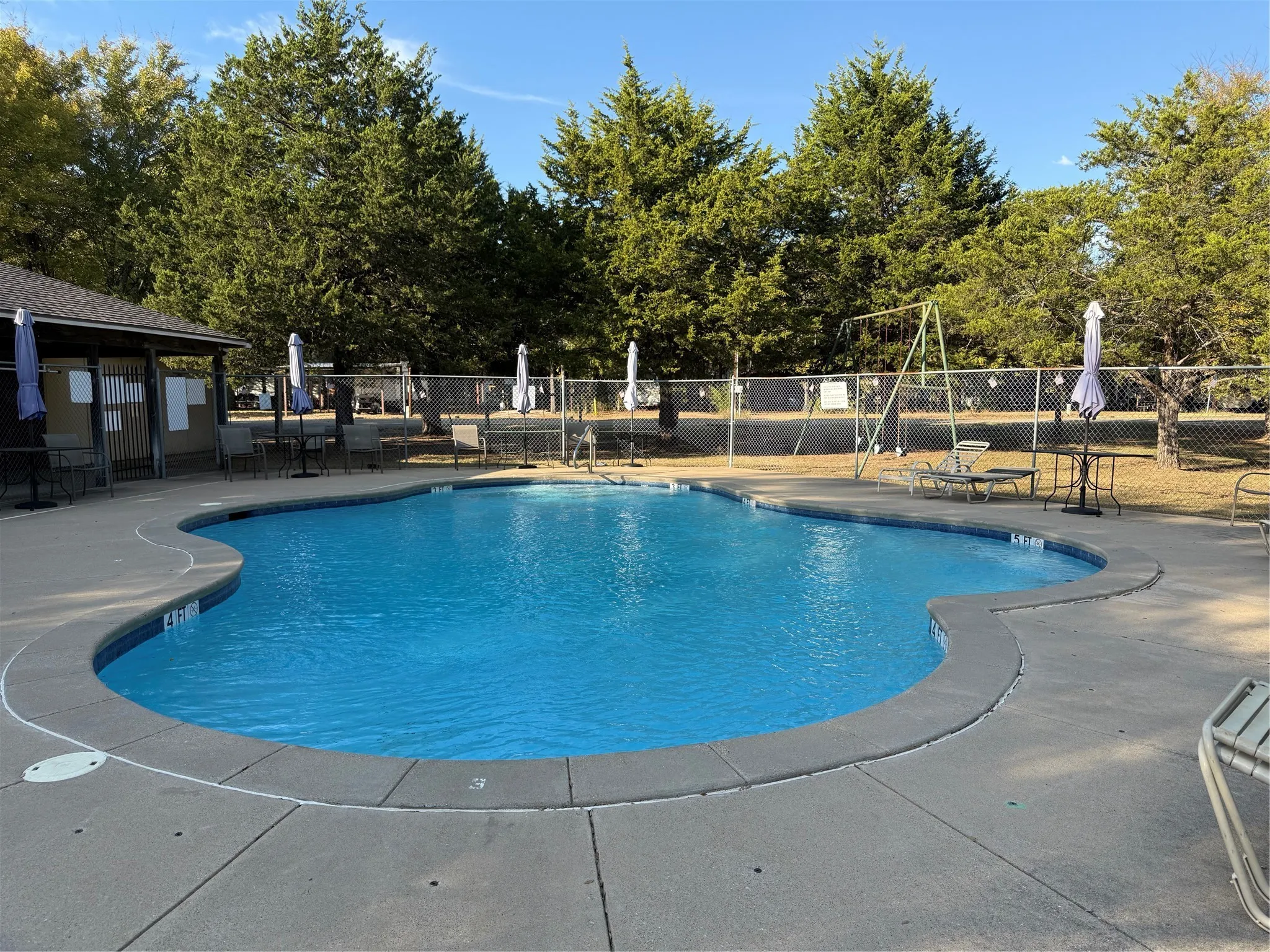 Community pool featuring a patio