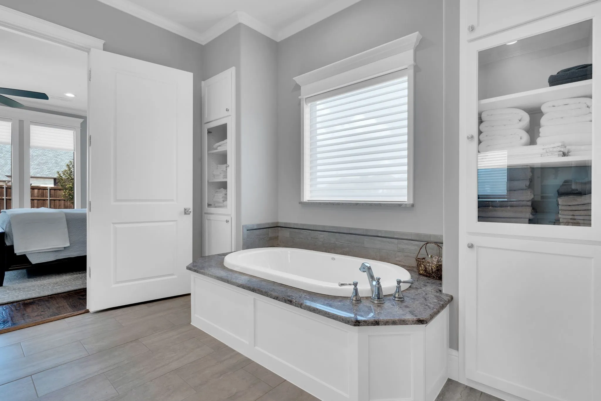 Full bath with a bath, ensuite bathroom, and ornamental molding