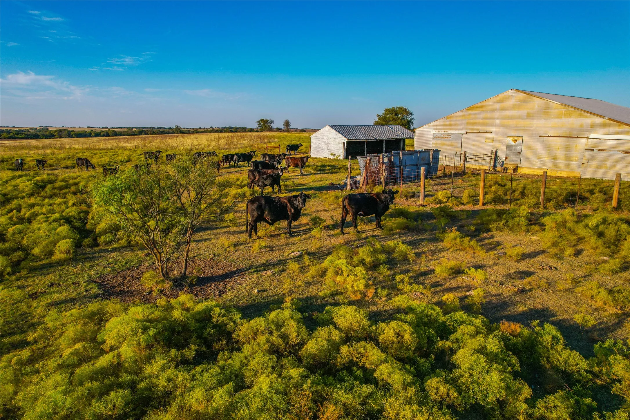 View of yard featuring an outbuilding, a rural view, and a pole building