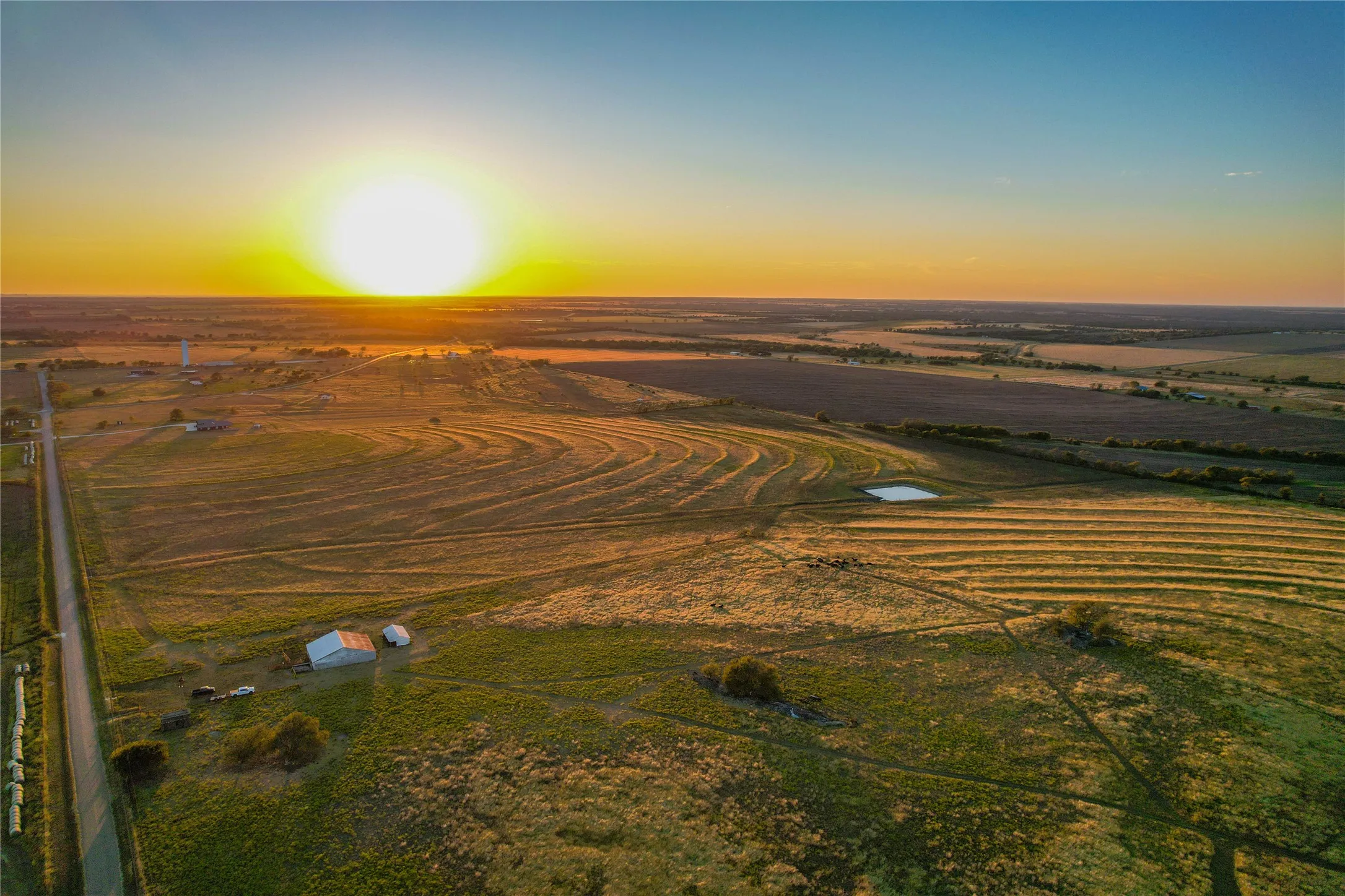 Aerial view at dusk of a view of rural / pastoral area and agricultural area