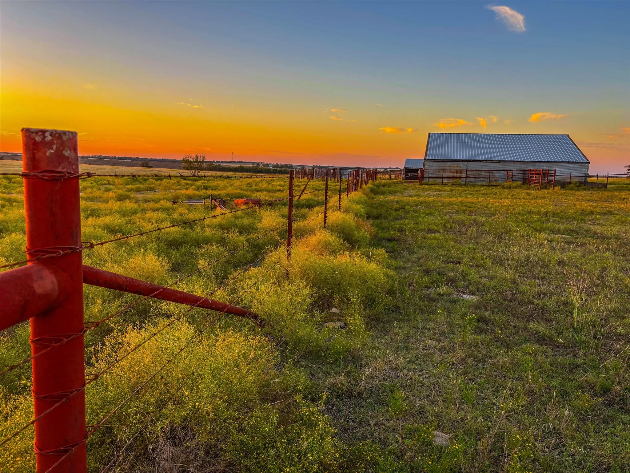 View of yard with an outbuilding and a view of countryside