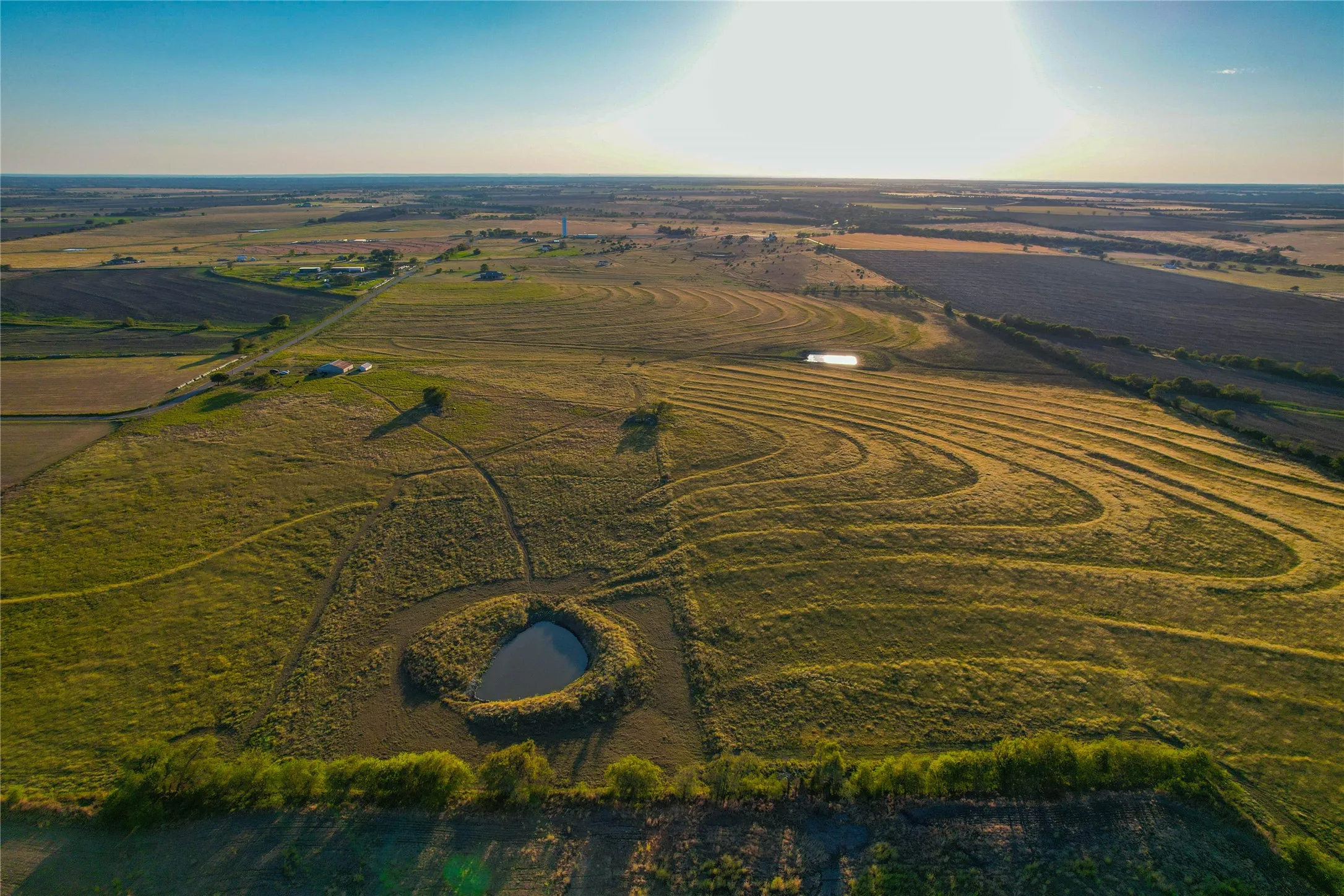 Aerial view of property and surrounding area featuring rural landscape