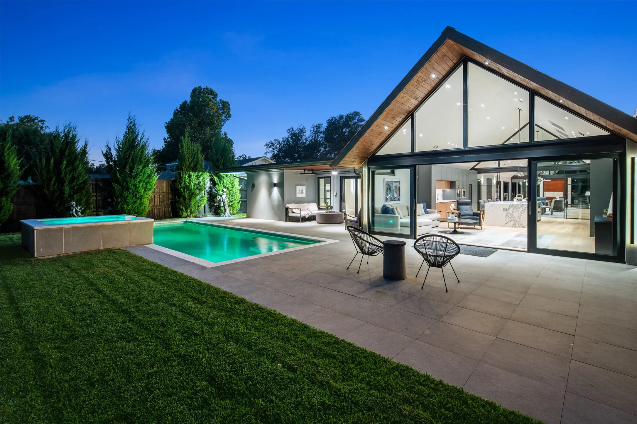 Walls of glass doors open to bring the indoors and outdoors together...