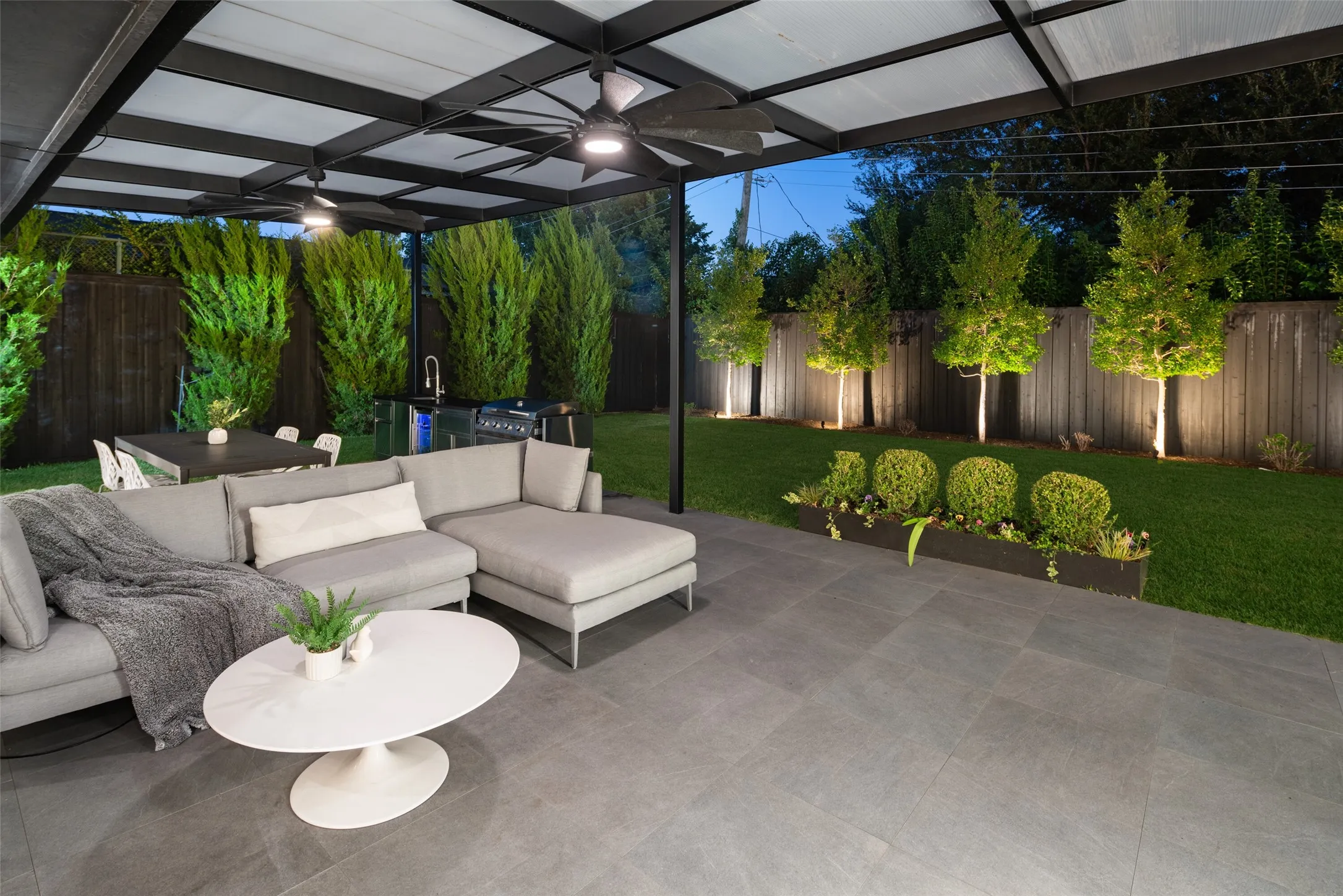 One of two outdoor living areas- a second is tucked behind primary bedroom...
