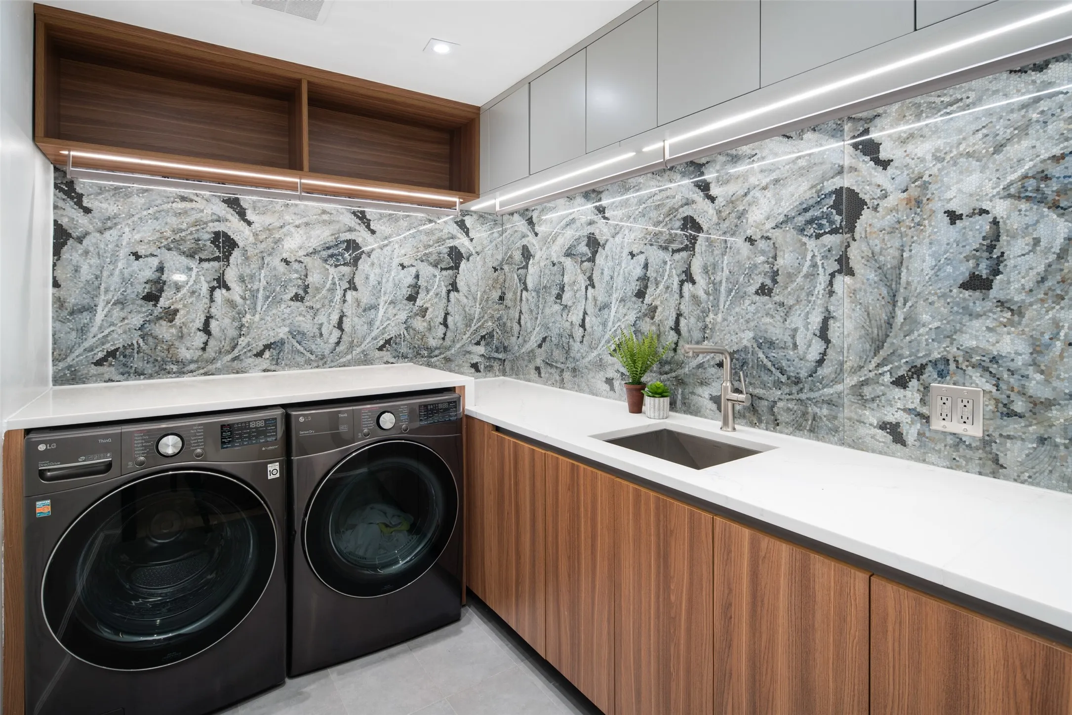 Thoughfully designed and finished laundry room off of side entry...