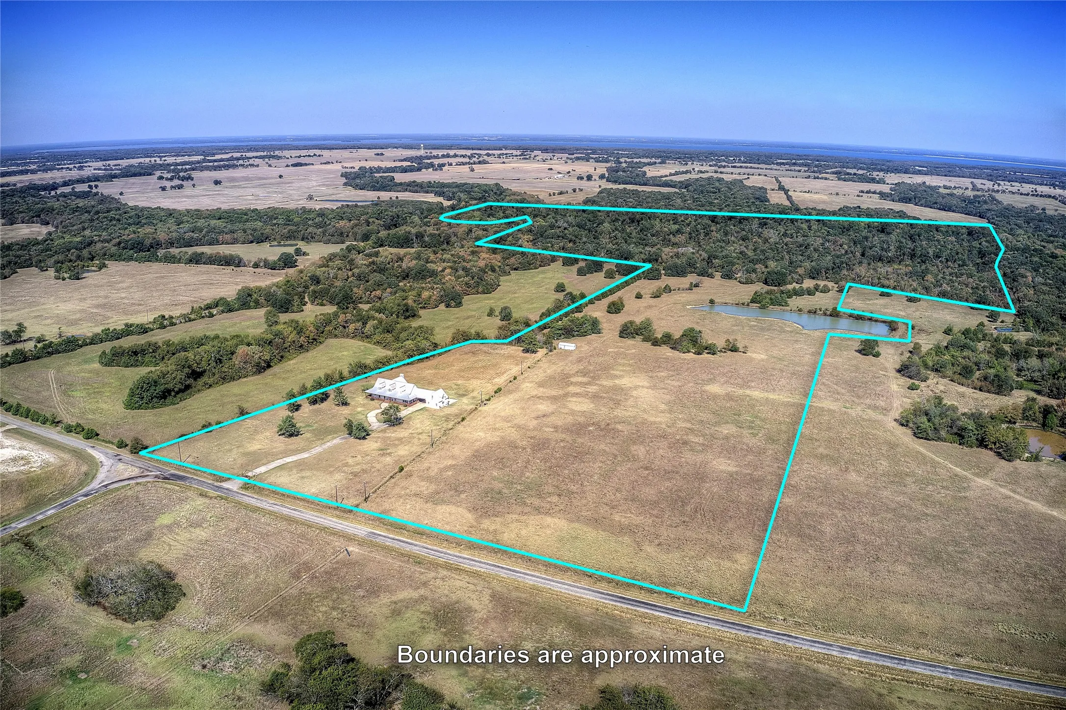 Aerial view of house and property with approximate boundaries drawn.