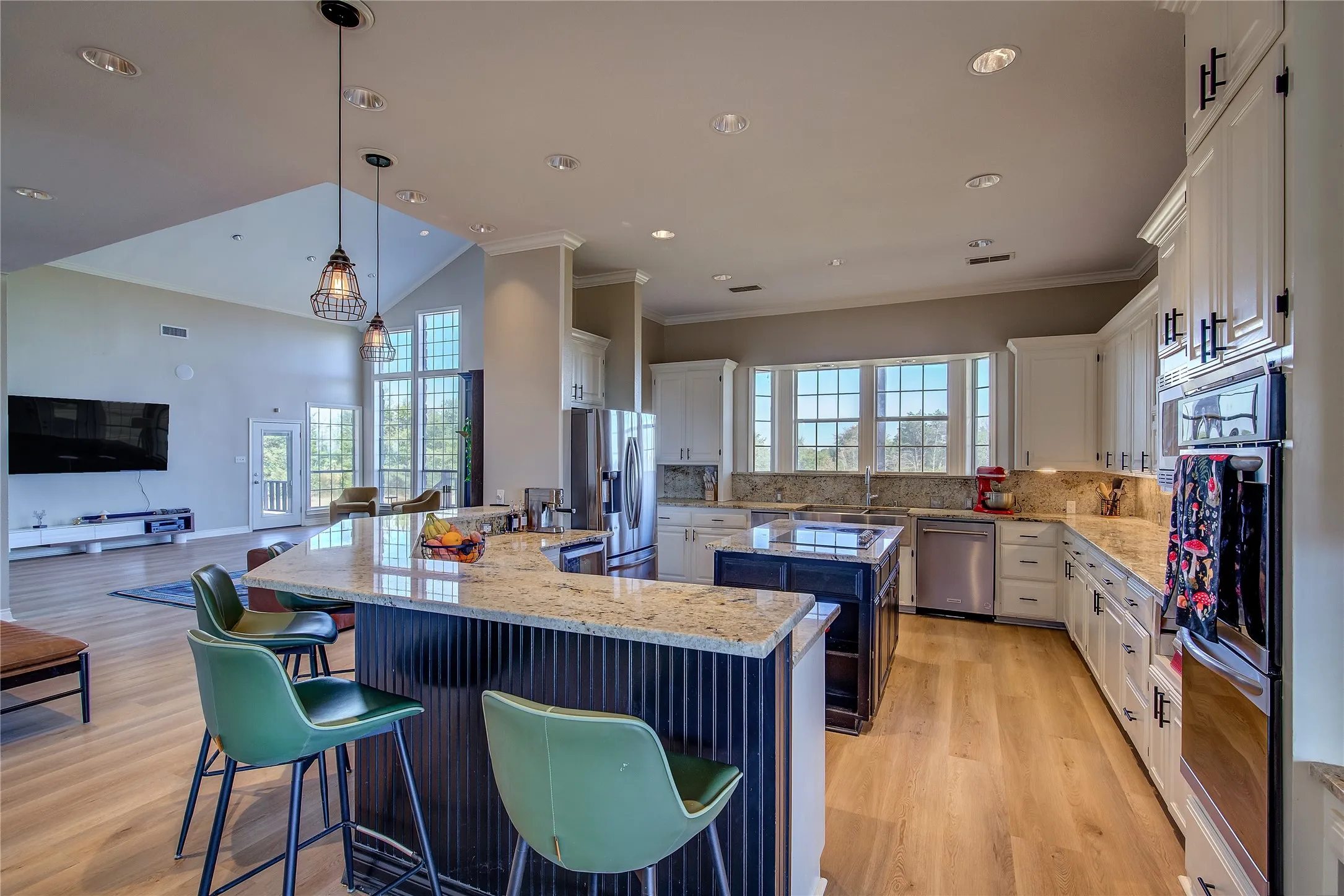Breakfast bar seats 6, with center island, wine chiller, double oven, double SS farm sink, trash compactor, and tons of custom cabinetry.