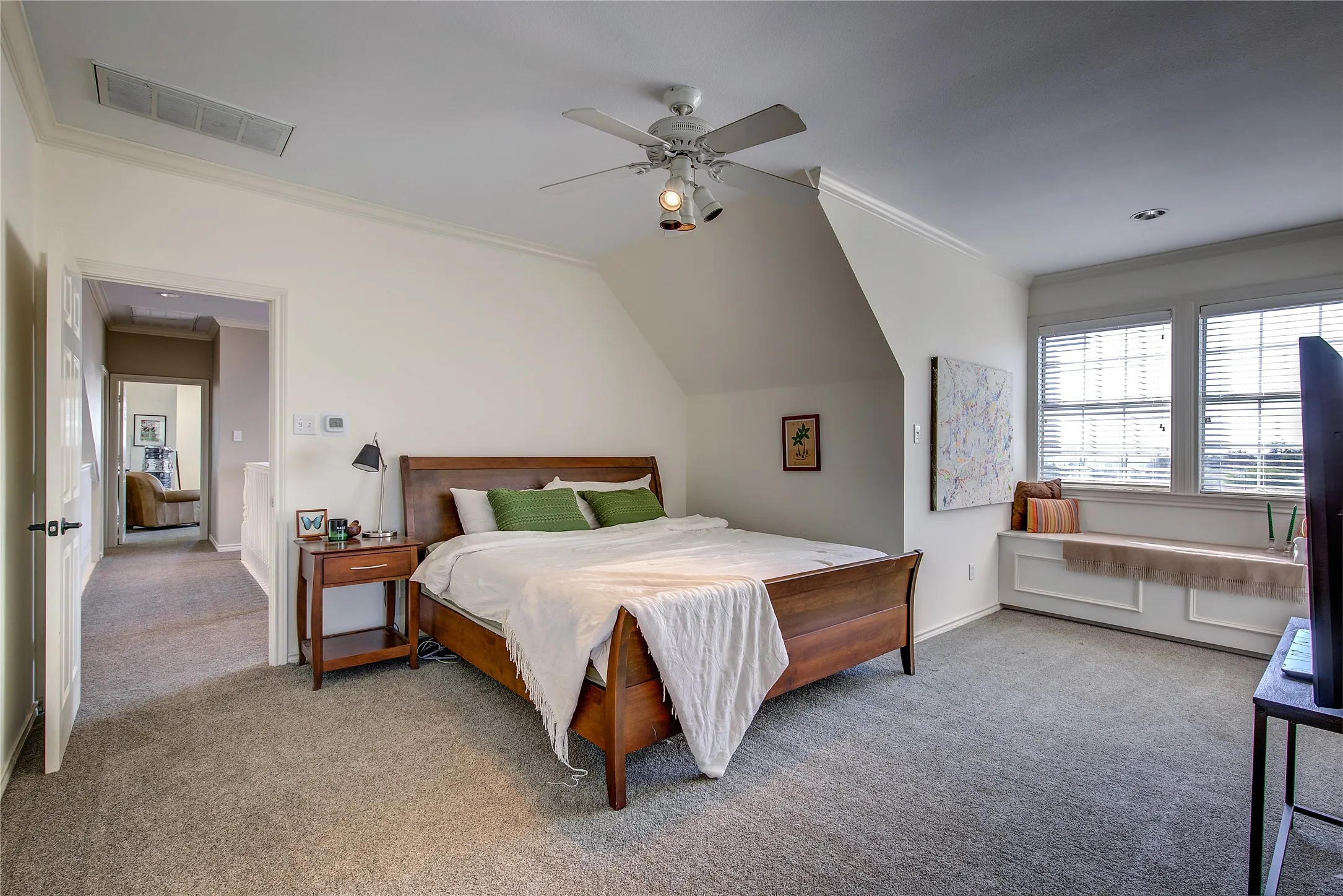 Bedroom 3 upstairs is oversized, with window seating built in and ensuite bathroom