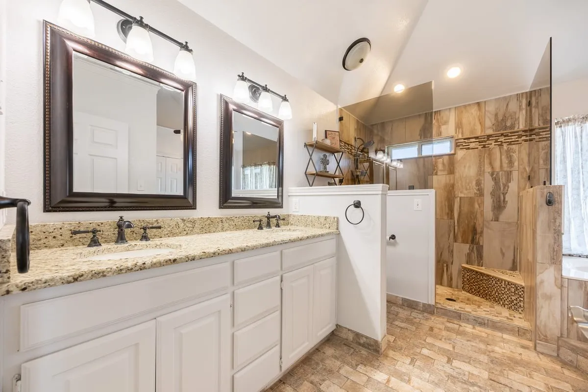 Main House Primary bathroom with walk in shower.