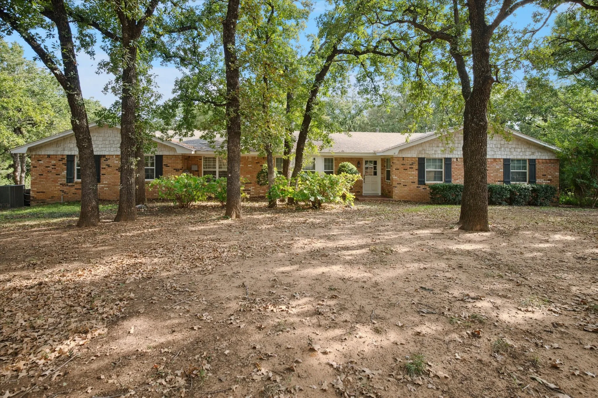 Single story home featuring brick siding