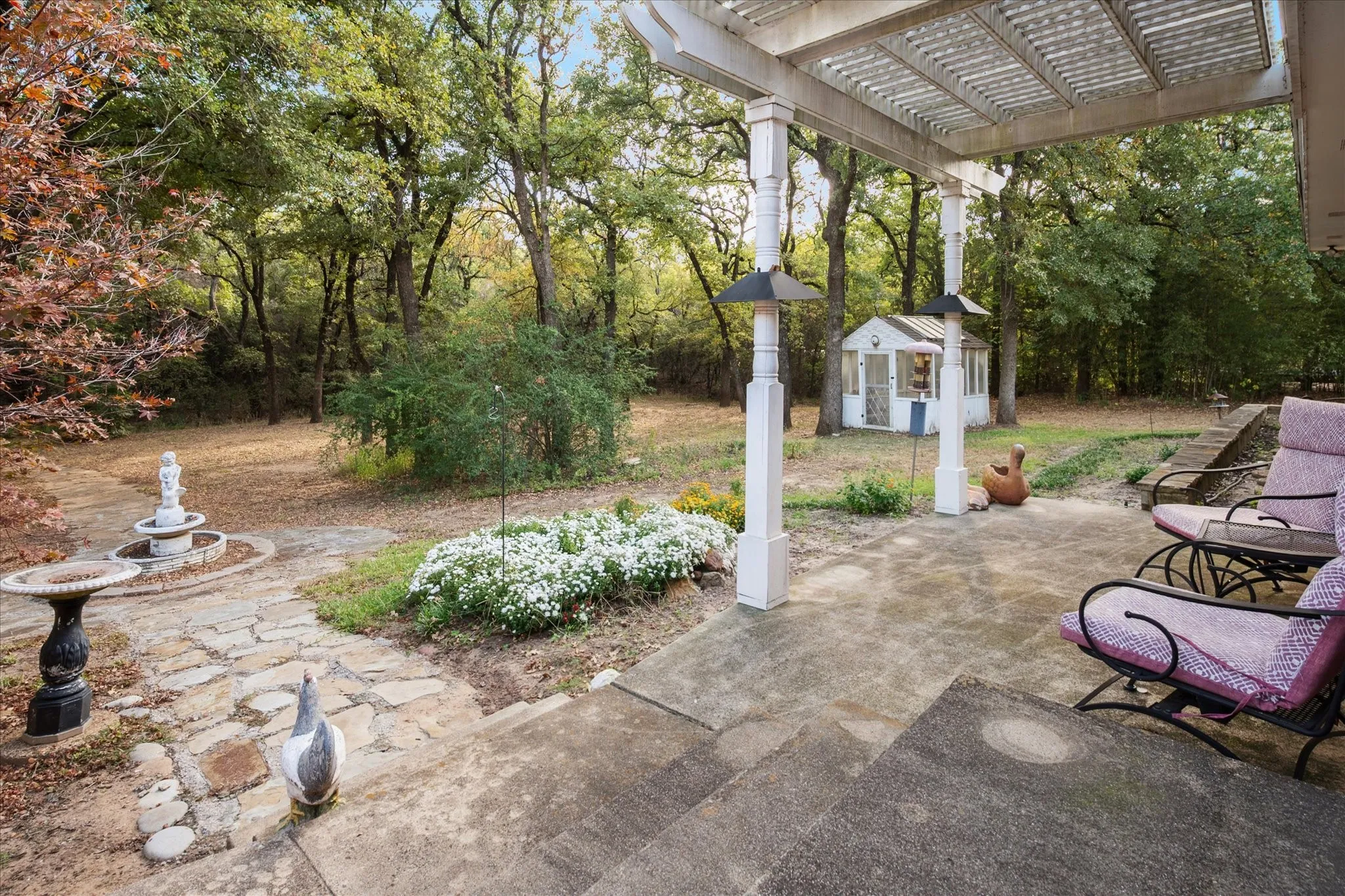 View of patio / terrace featuring a pergola and an outdoor structure