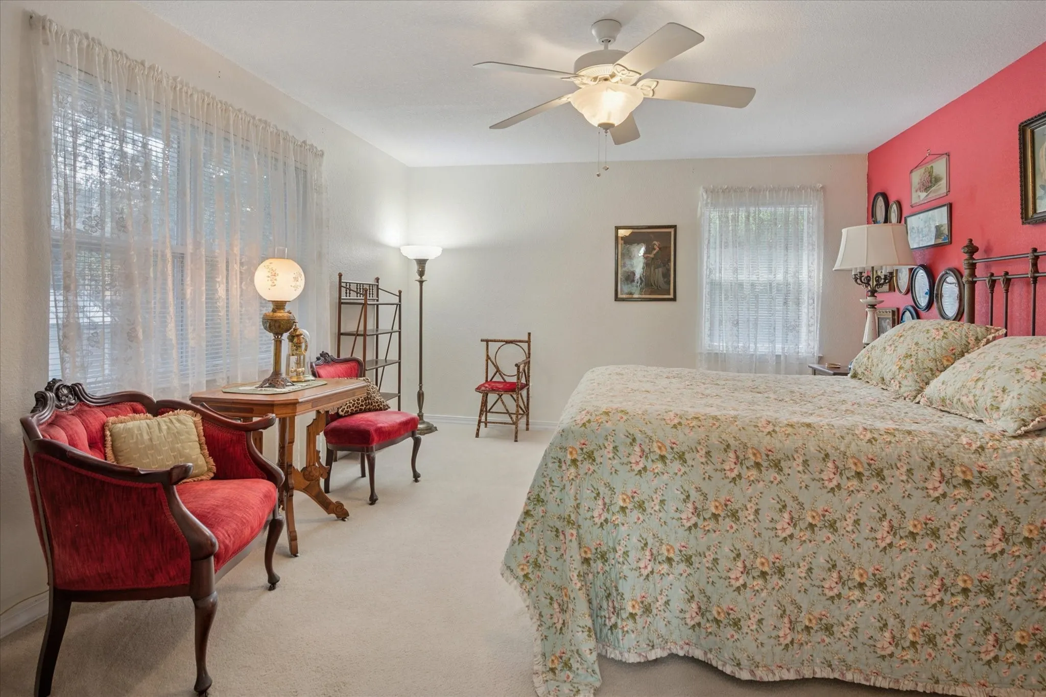 Bedroom featuring light colored carpet and ceiling fan