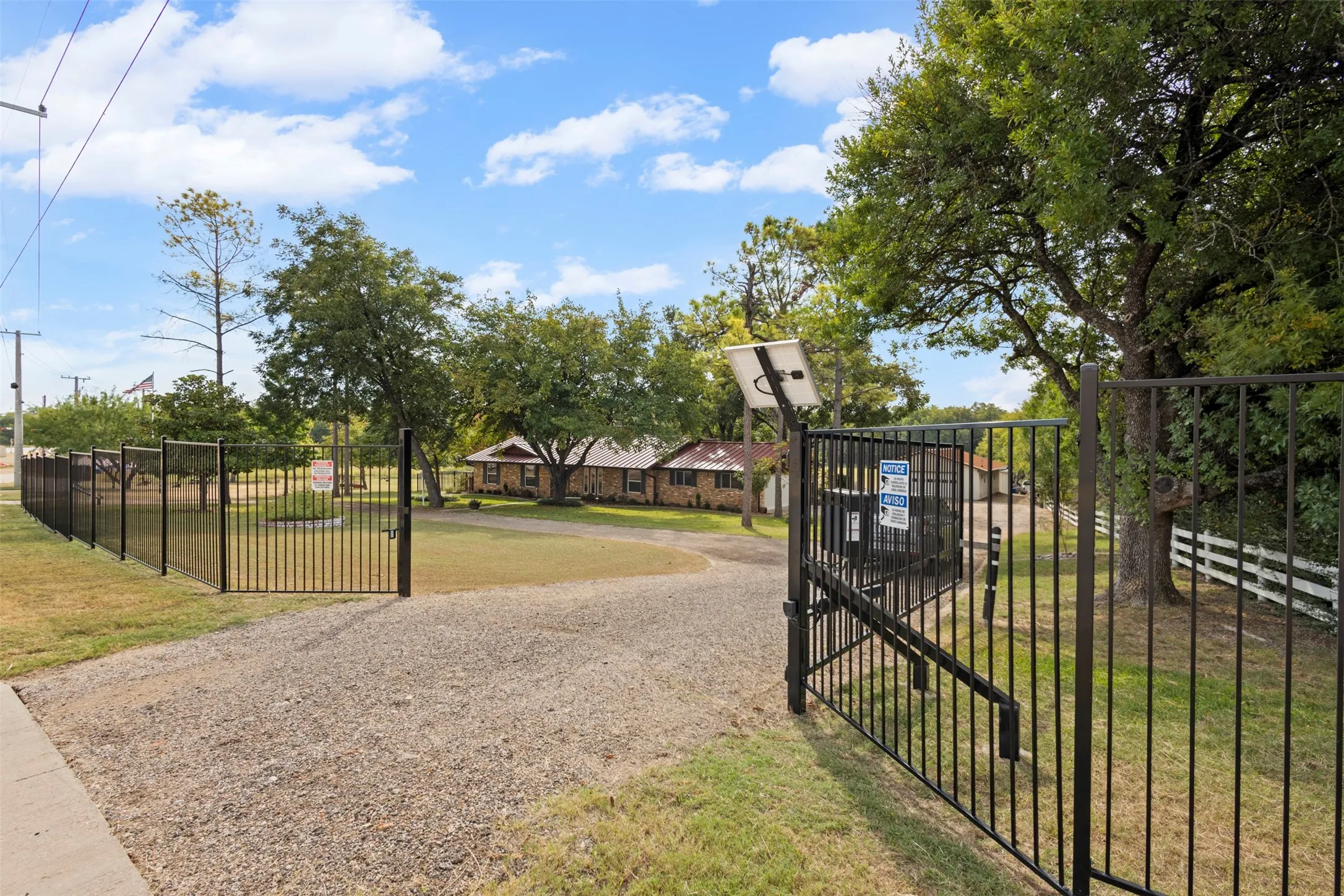 Property includes new wrought iron fence and automatic gates