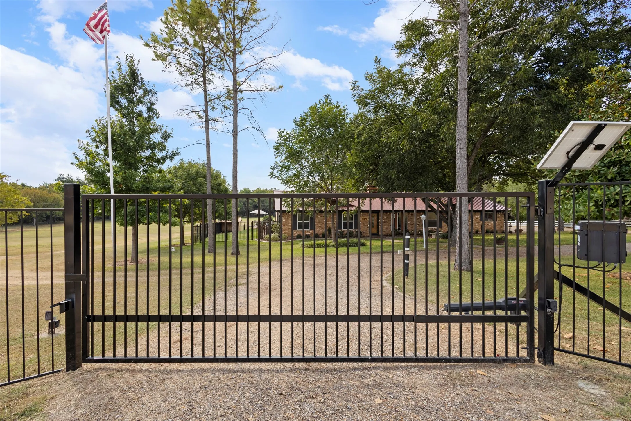 Property includes new wrought iron fence and automatic gates