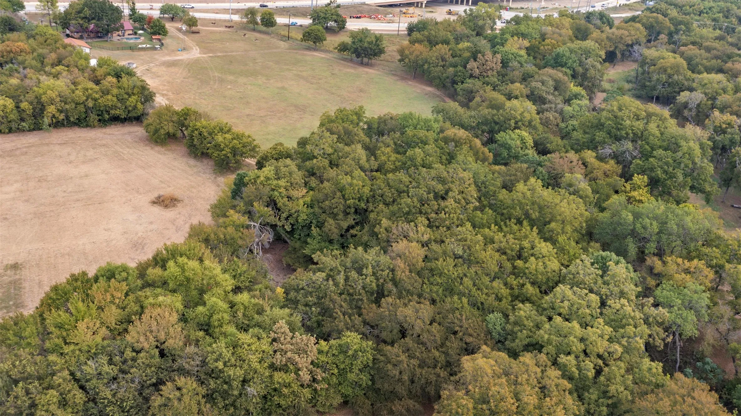 Discover this breathtaking 5.9-acre estate located on East Bound Frontage Road in Grand Prairie.