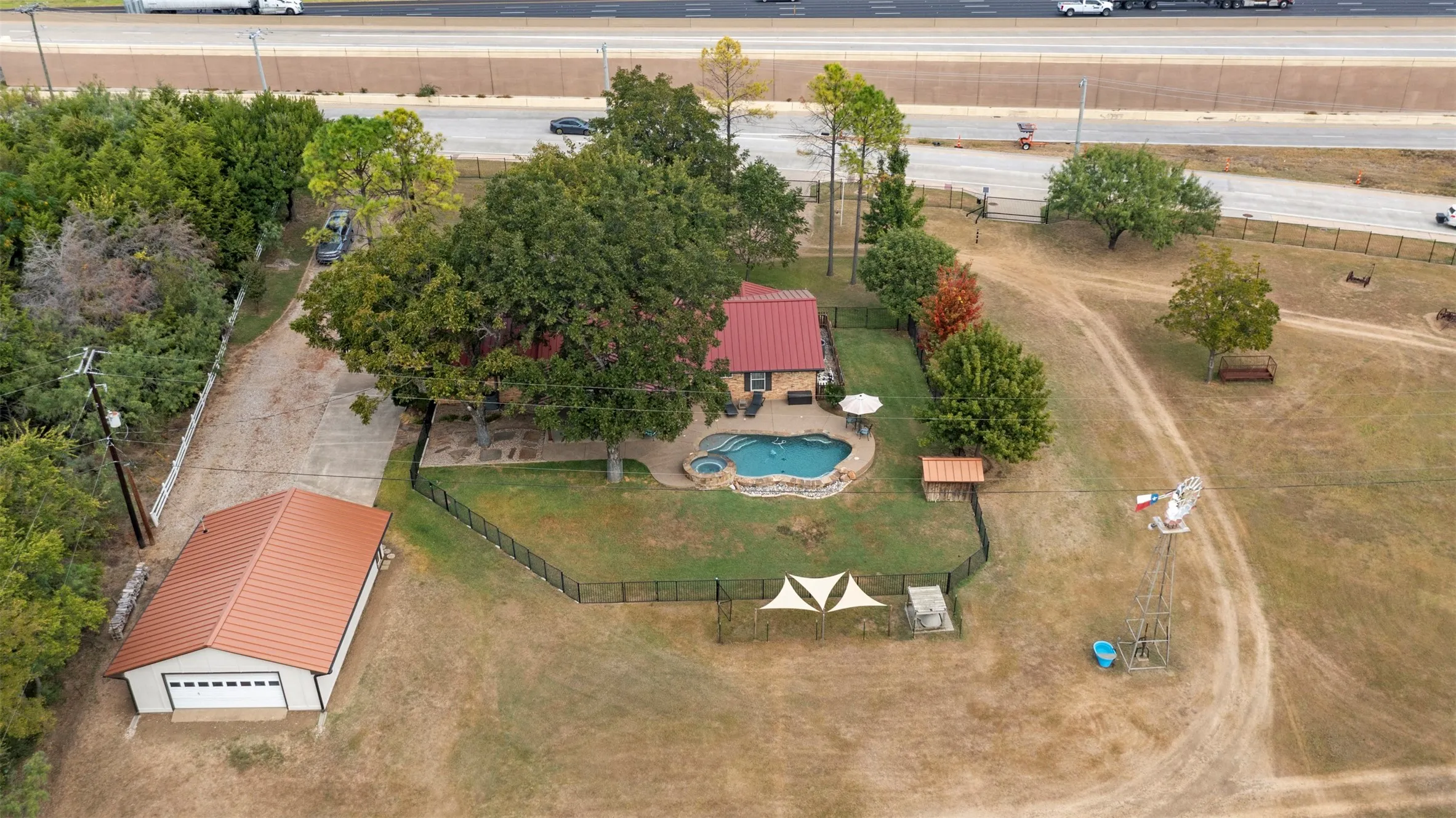 Discover this breathtaking 5.9-acre estate located on East Bound Frontage Road in Grand Prairie.