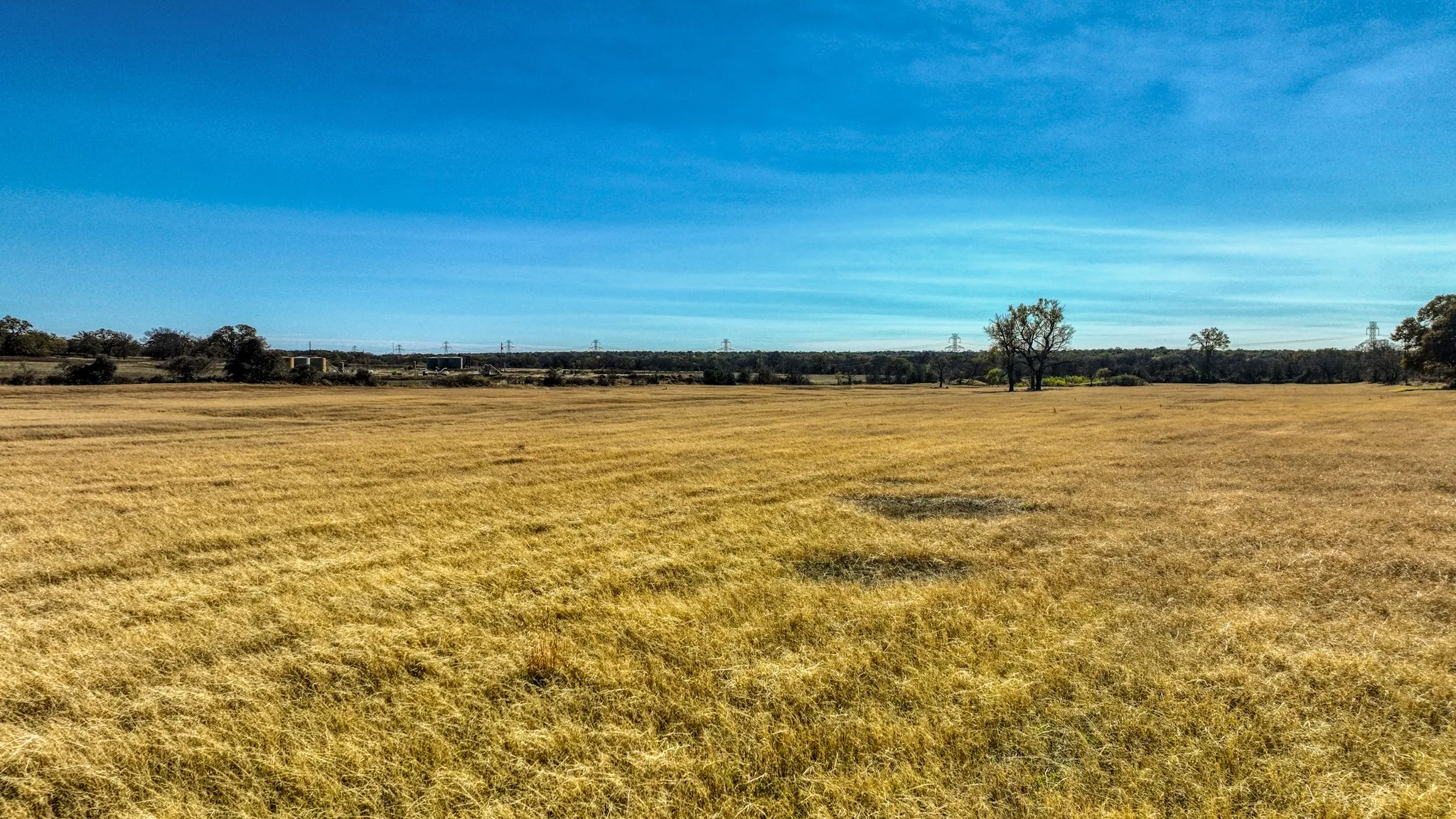 View of green lawn with a view of countryside