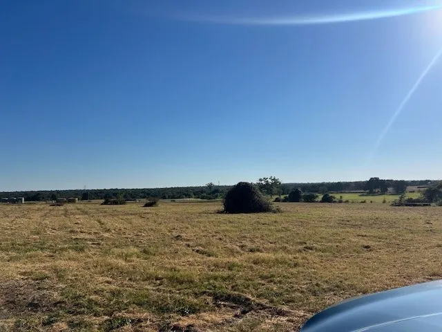 View of green lawn with a view of rural / pastoral area