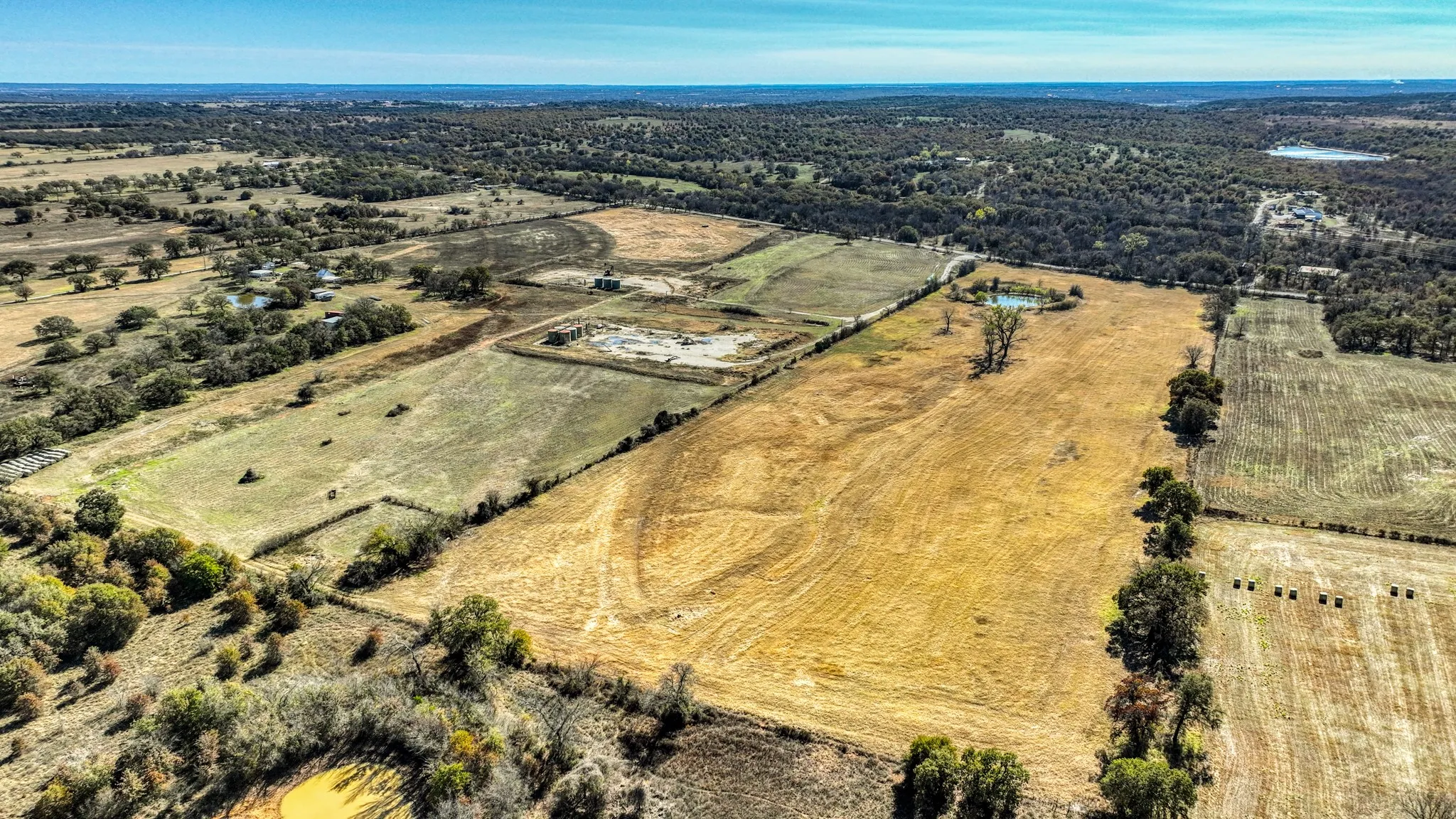 Aerial view of property and surrounding area featuring rural landscape