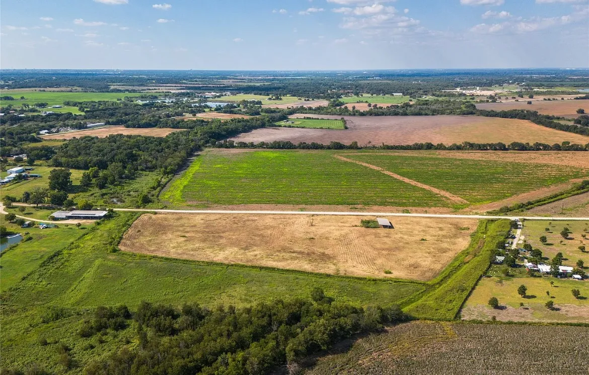 Aerial view of sparsely populated area with farmland