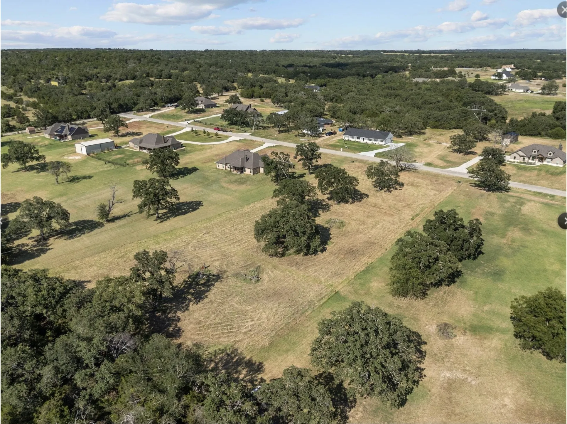 View of property location with a forest