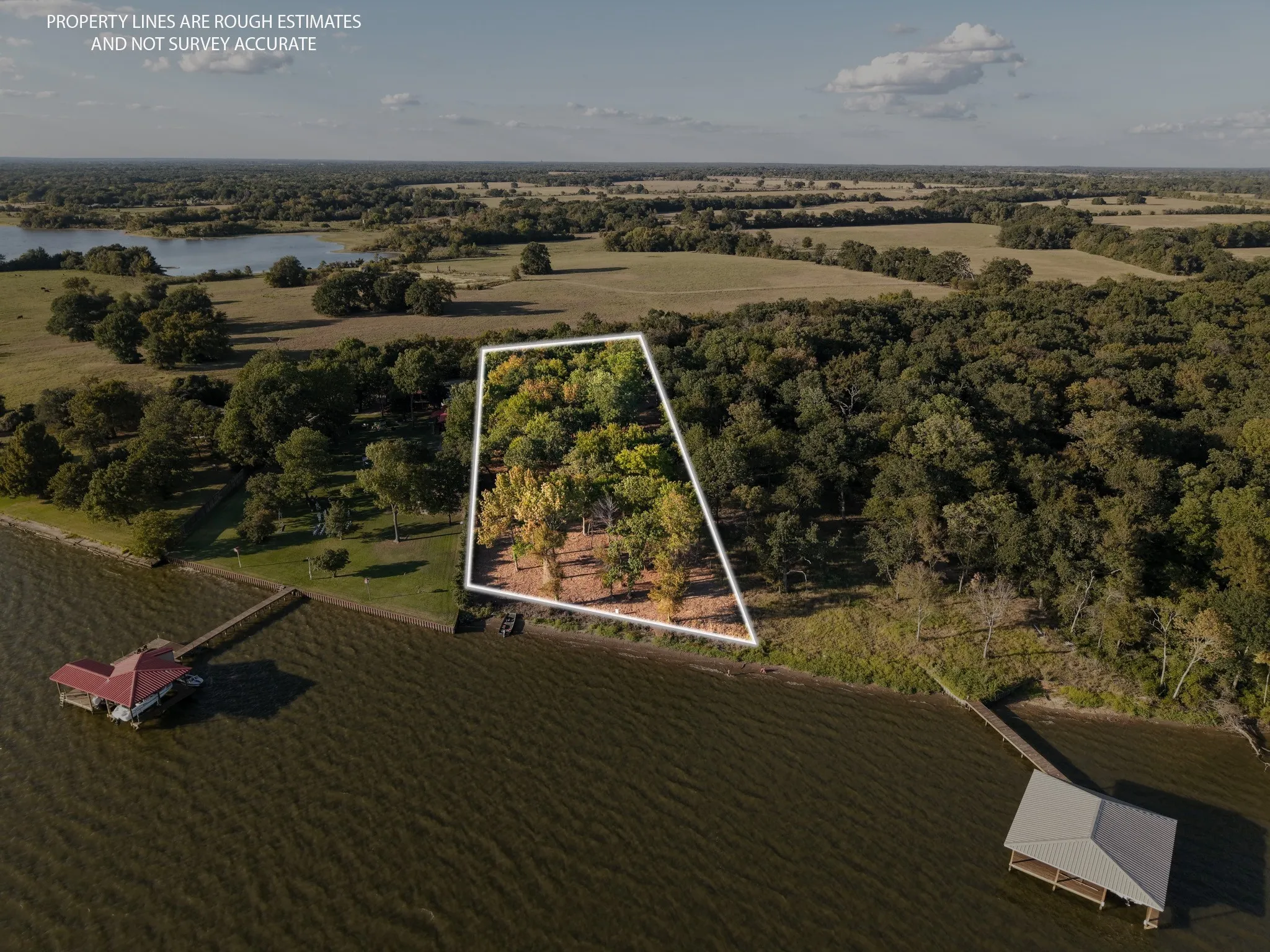 View of rural area with property boundaries highlighted and a nearby body of water