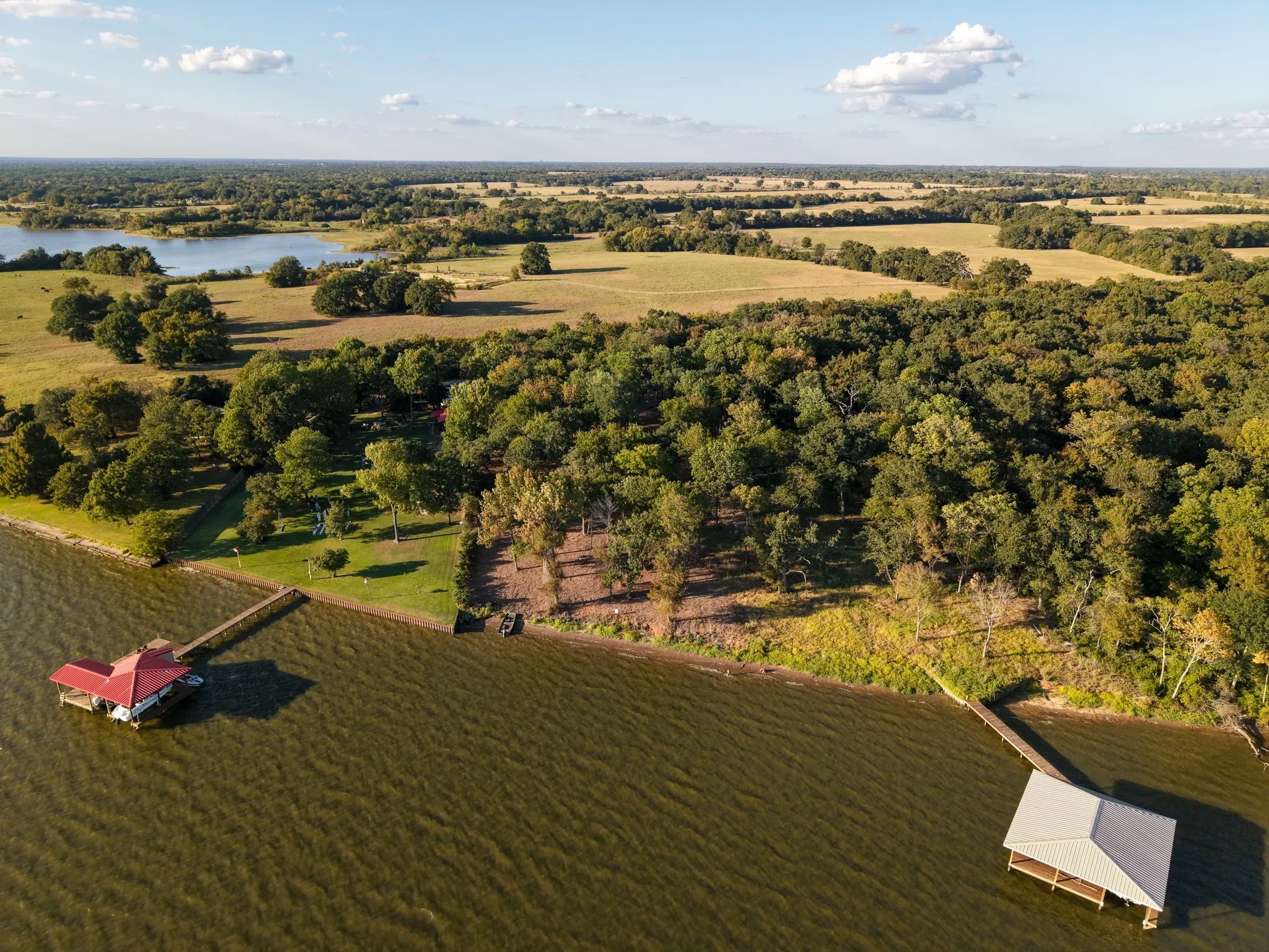 Overview of rural landscape featuring a nearby body of water