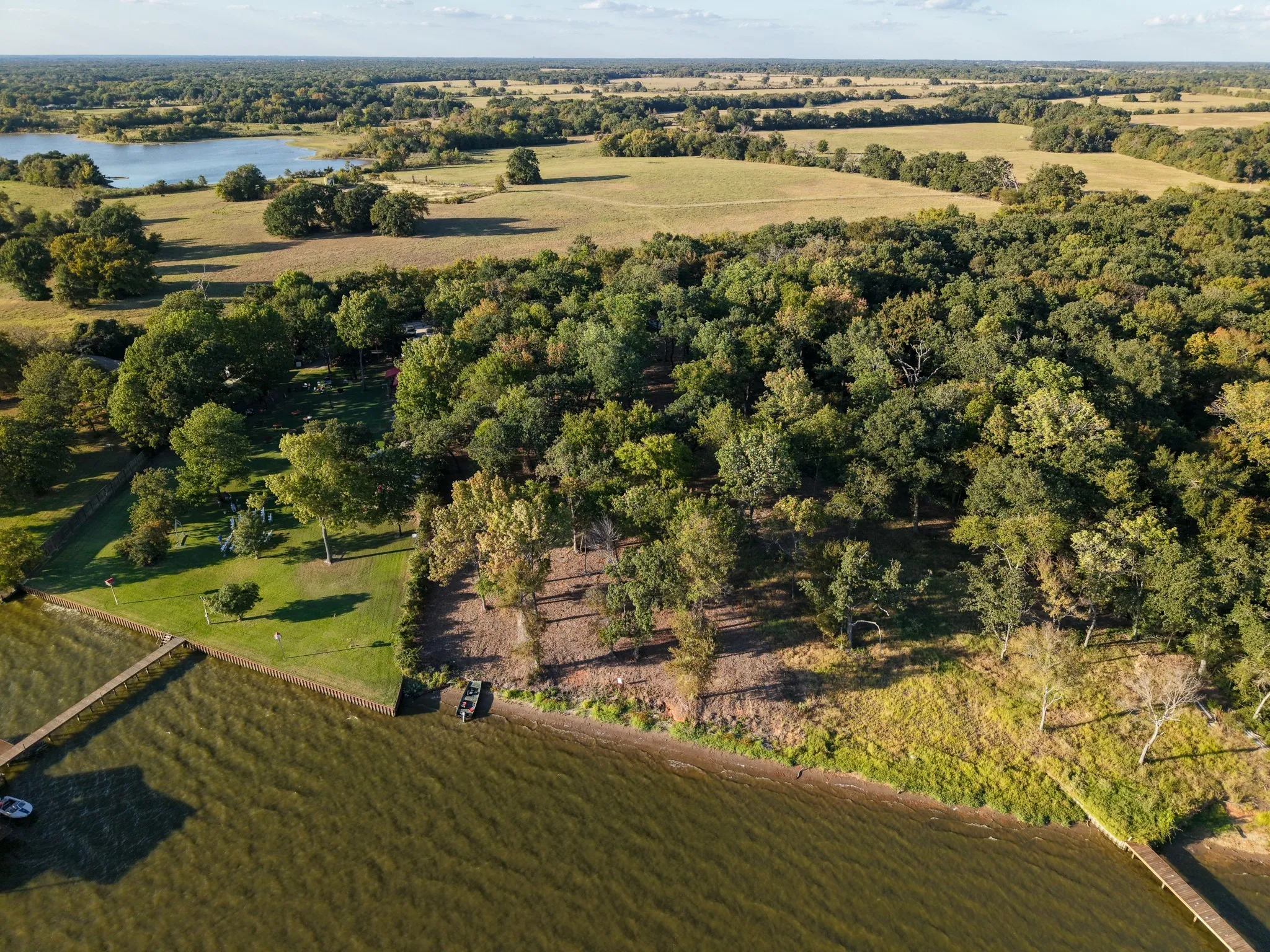 View of property location with a nearby body of water and rural landscape
