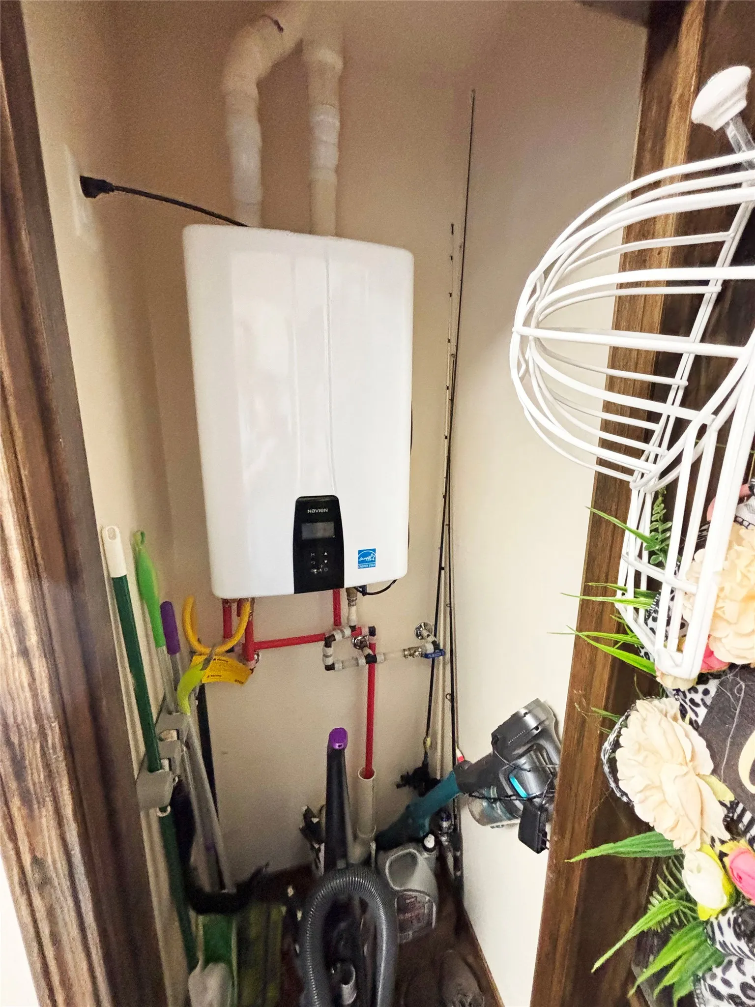 Utility room featuring water heater