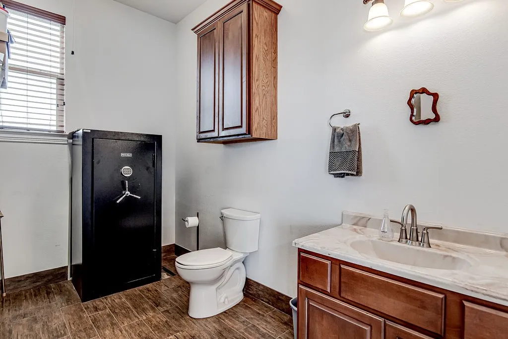 Bathroom with vanity and wood finish floors