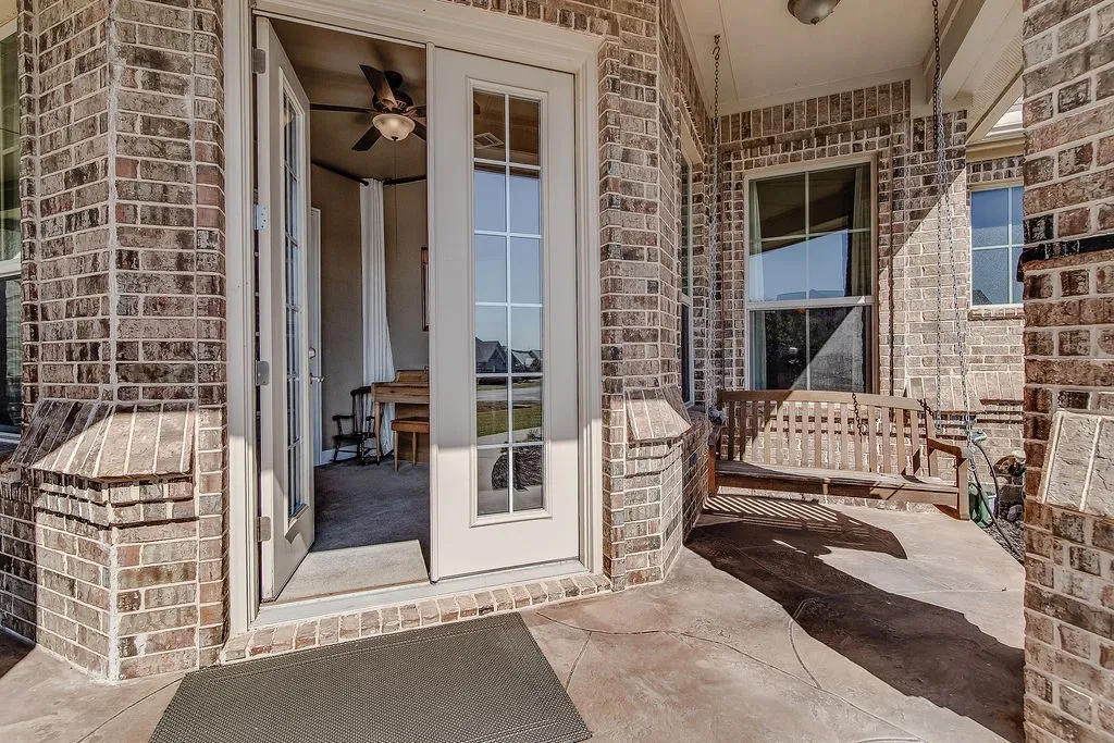 Property entrance featuring a patio area