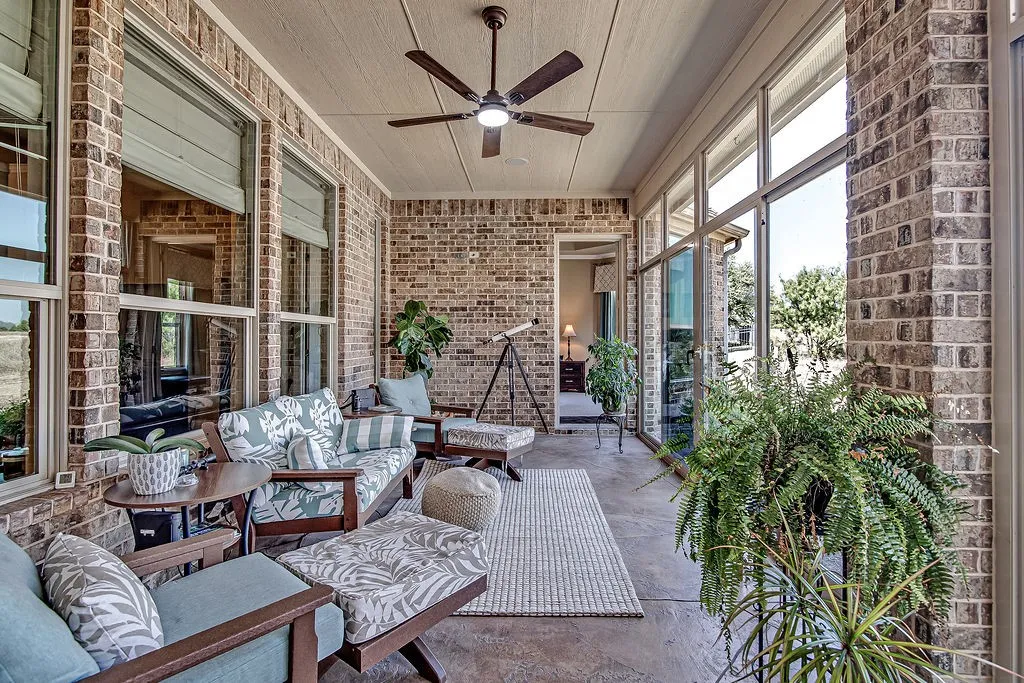 View of patio with ceiling fan and an outdoor living space