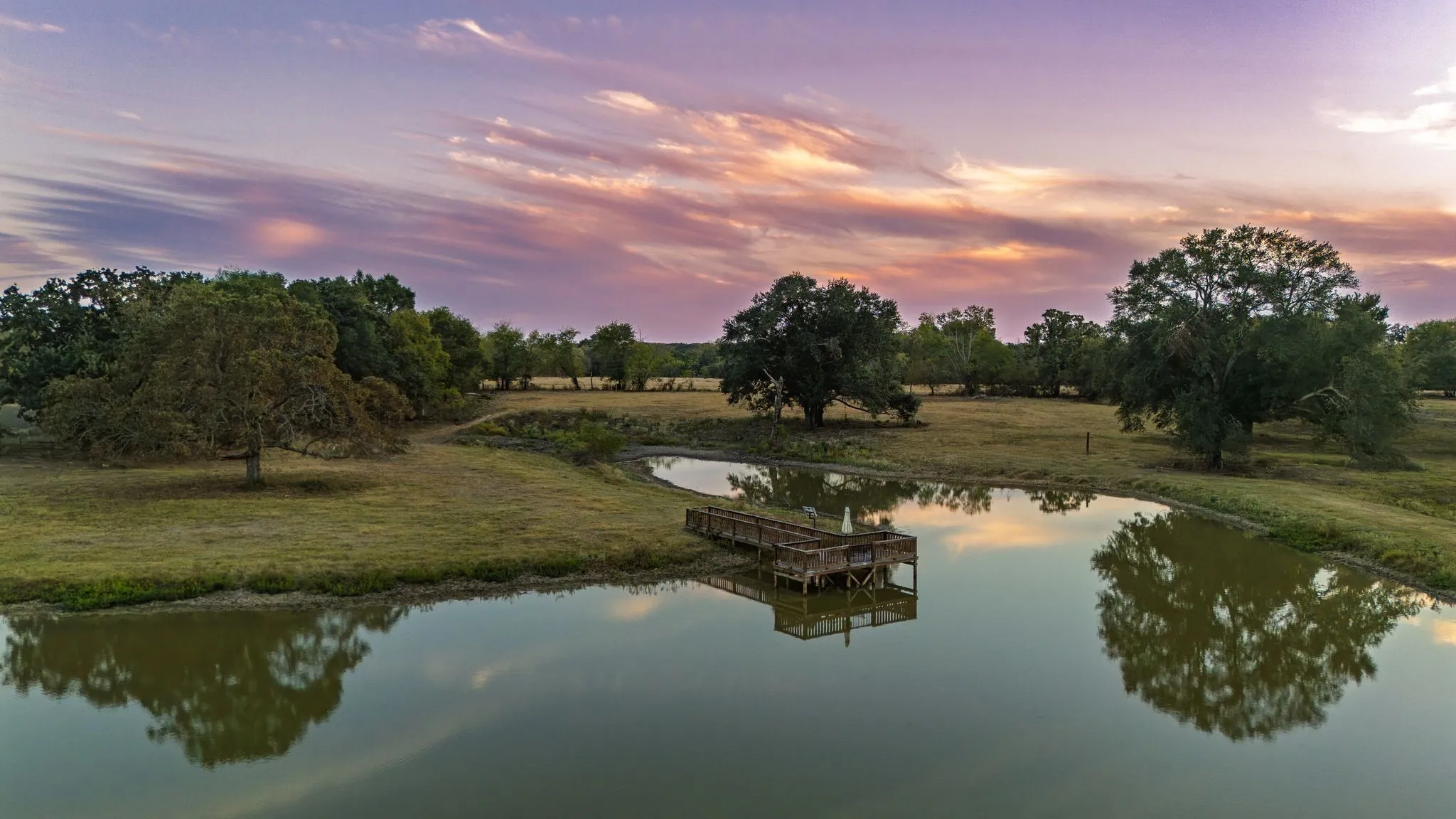 Sunset over larger pond/lake