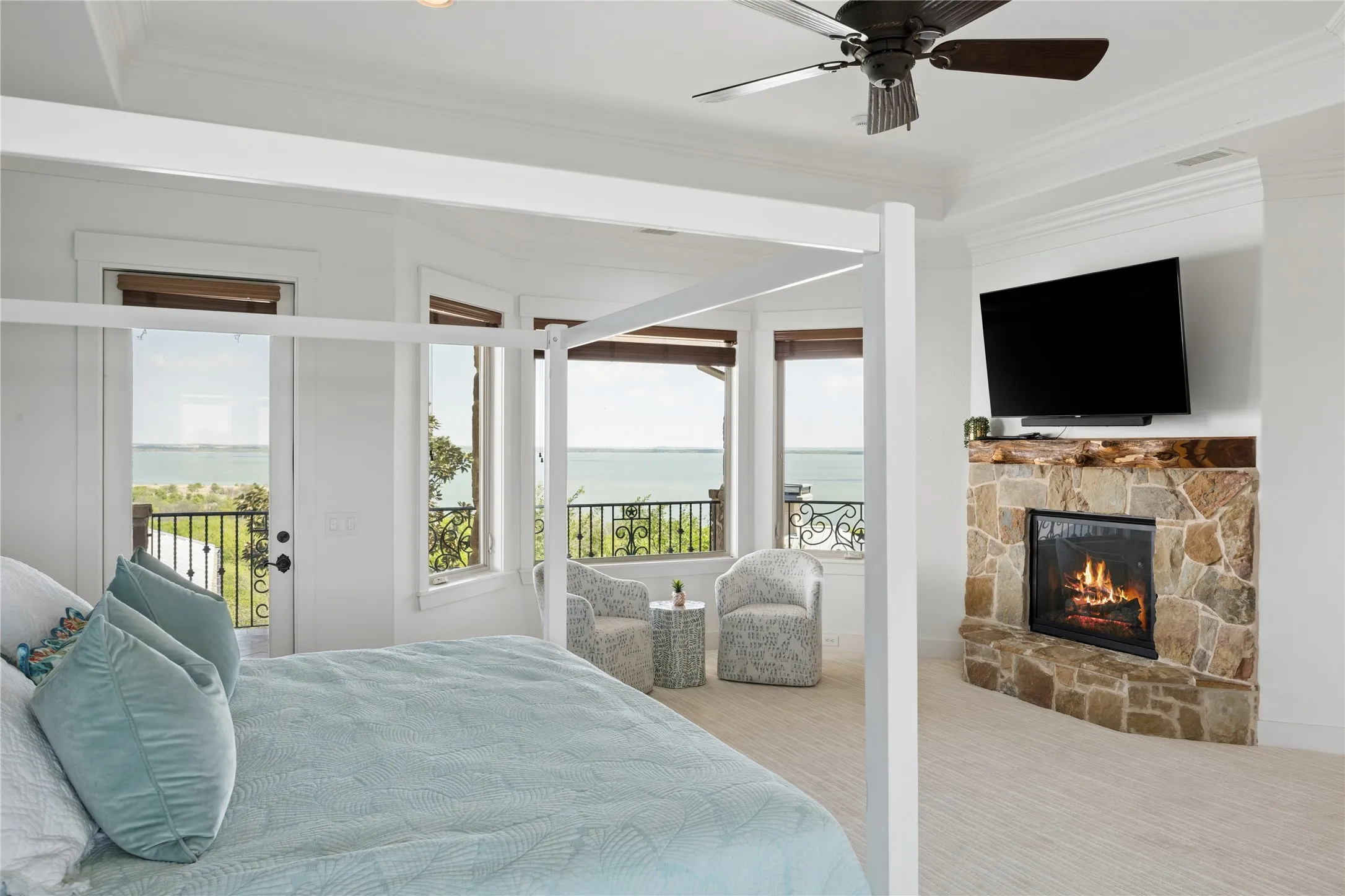 Stone-clad fireplace with a natural wood mantel