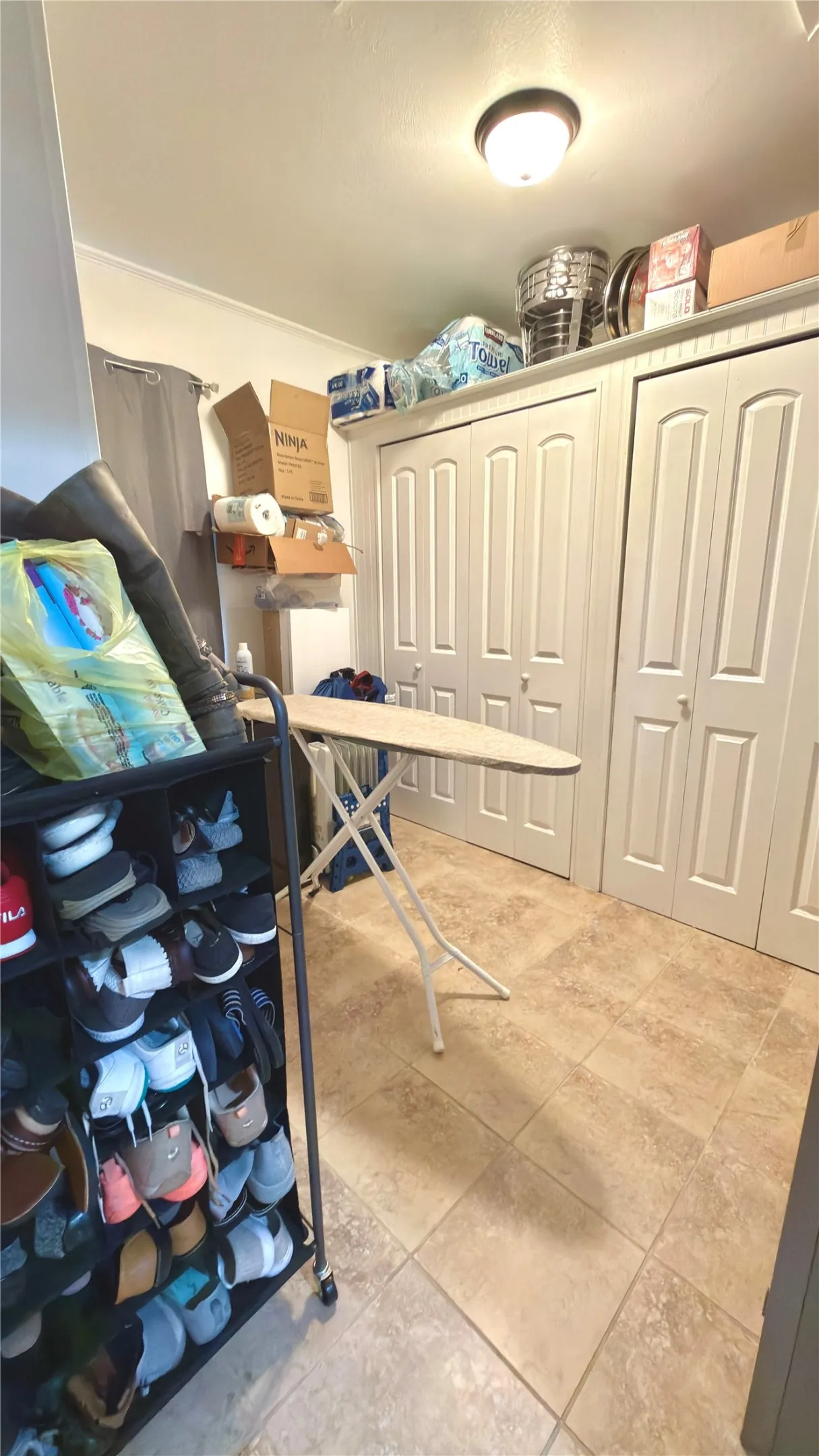 With a wall of closets on 2 sides.