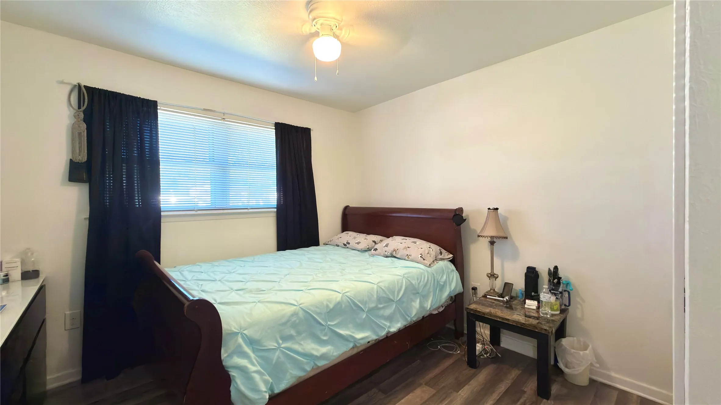 Bedroom featuring light wood floors and a ceiling fan