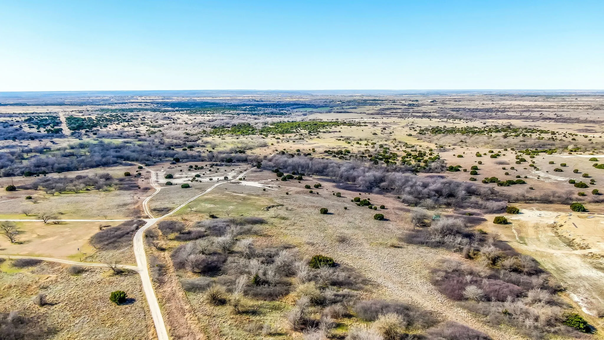 Aerial view of sparsely populated area featuring a desert landscape
